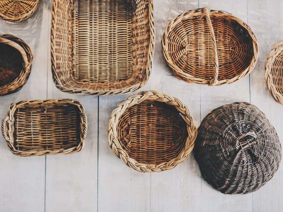 Use decorative woven baskets to declutter your living room space.