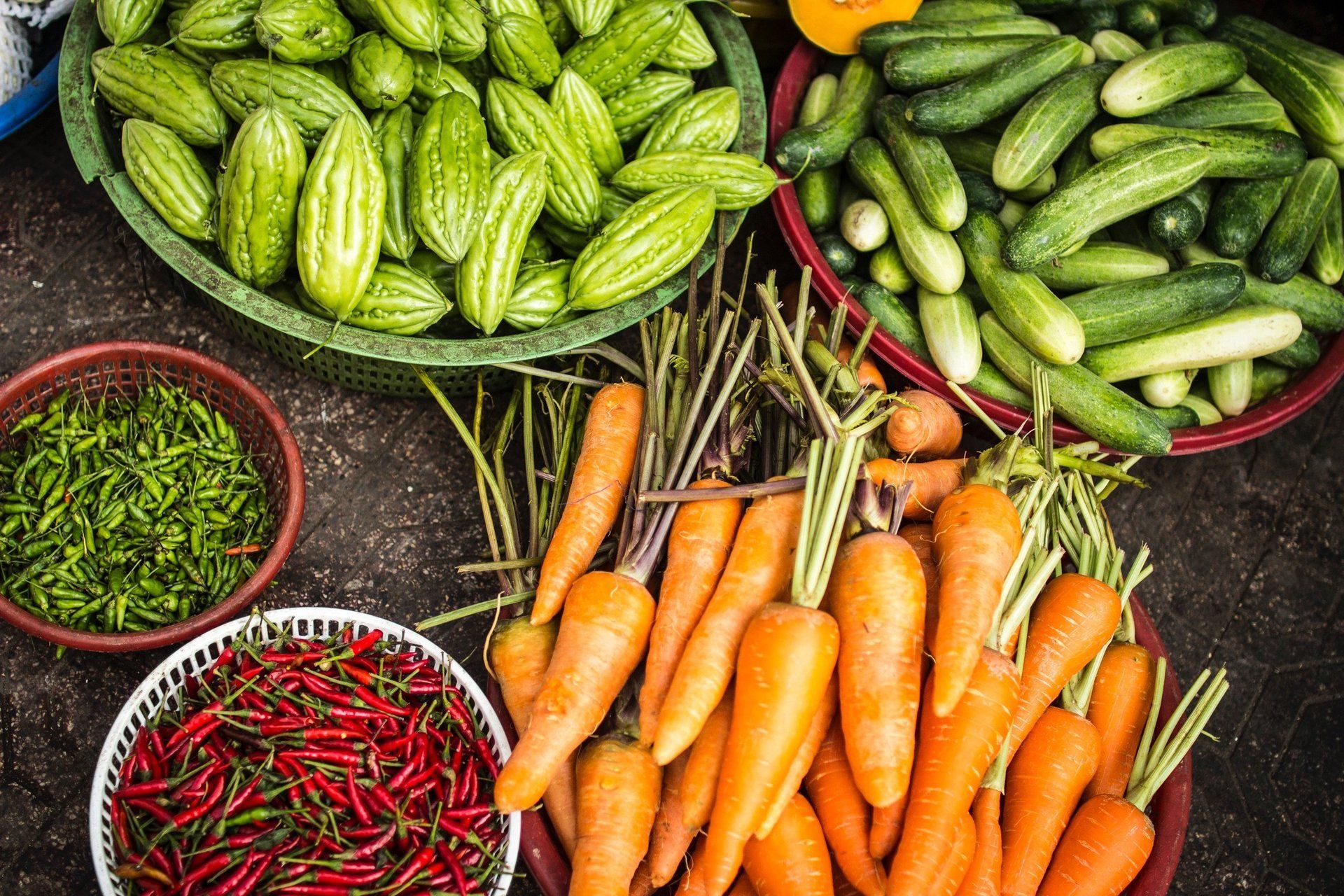 a variety of vegetables including carrots and peppers