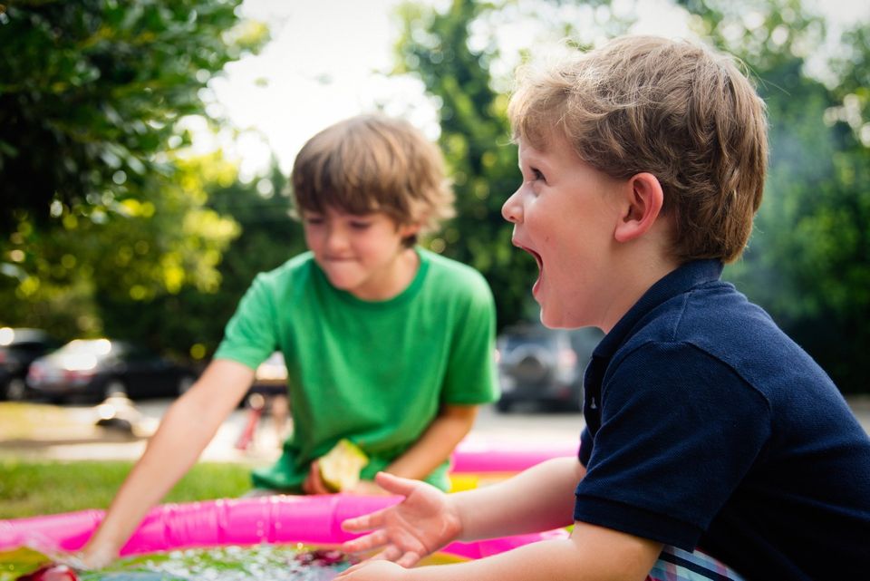 2 Children Enjoying Water Ballons