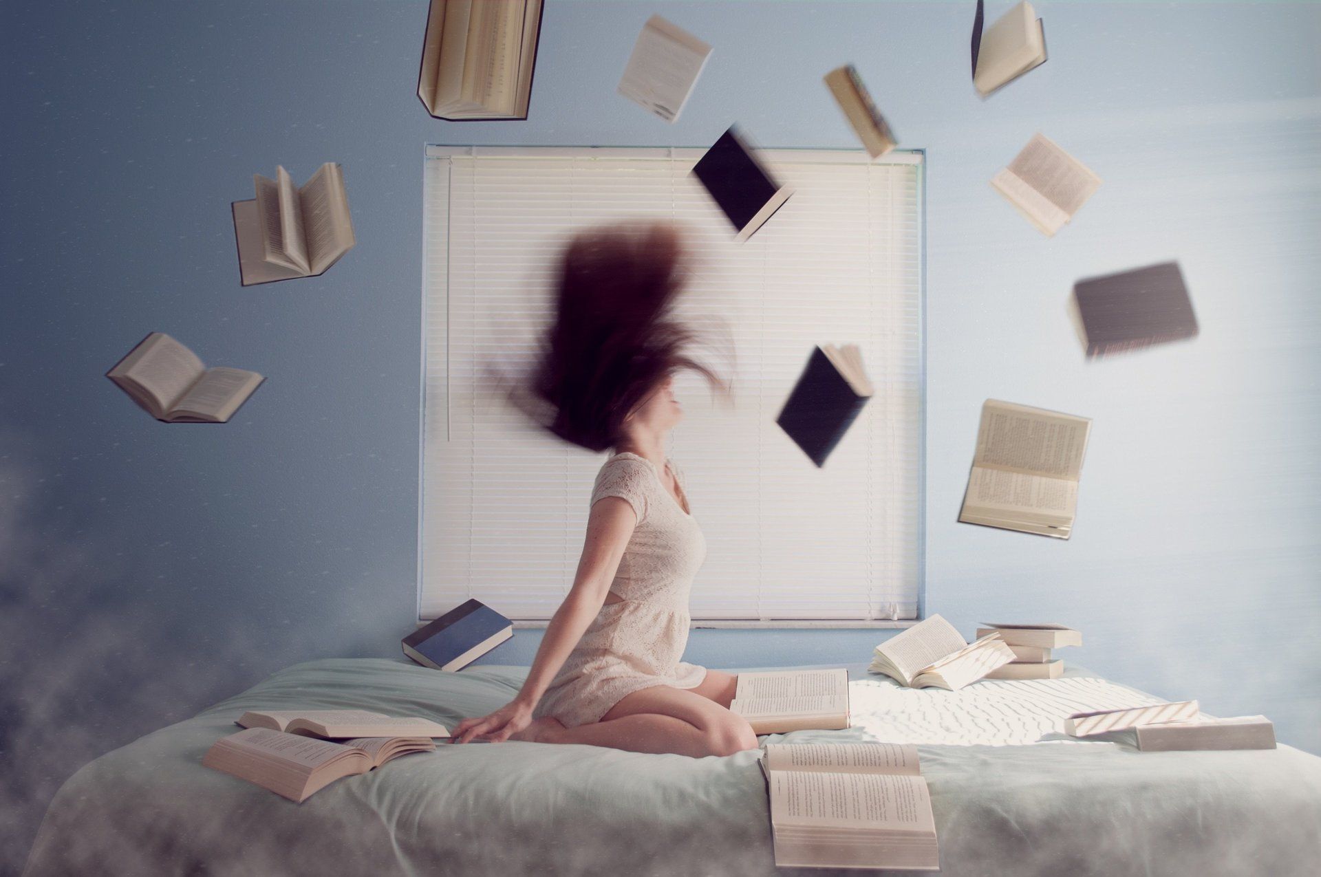 Girl throwing her books