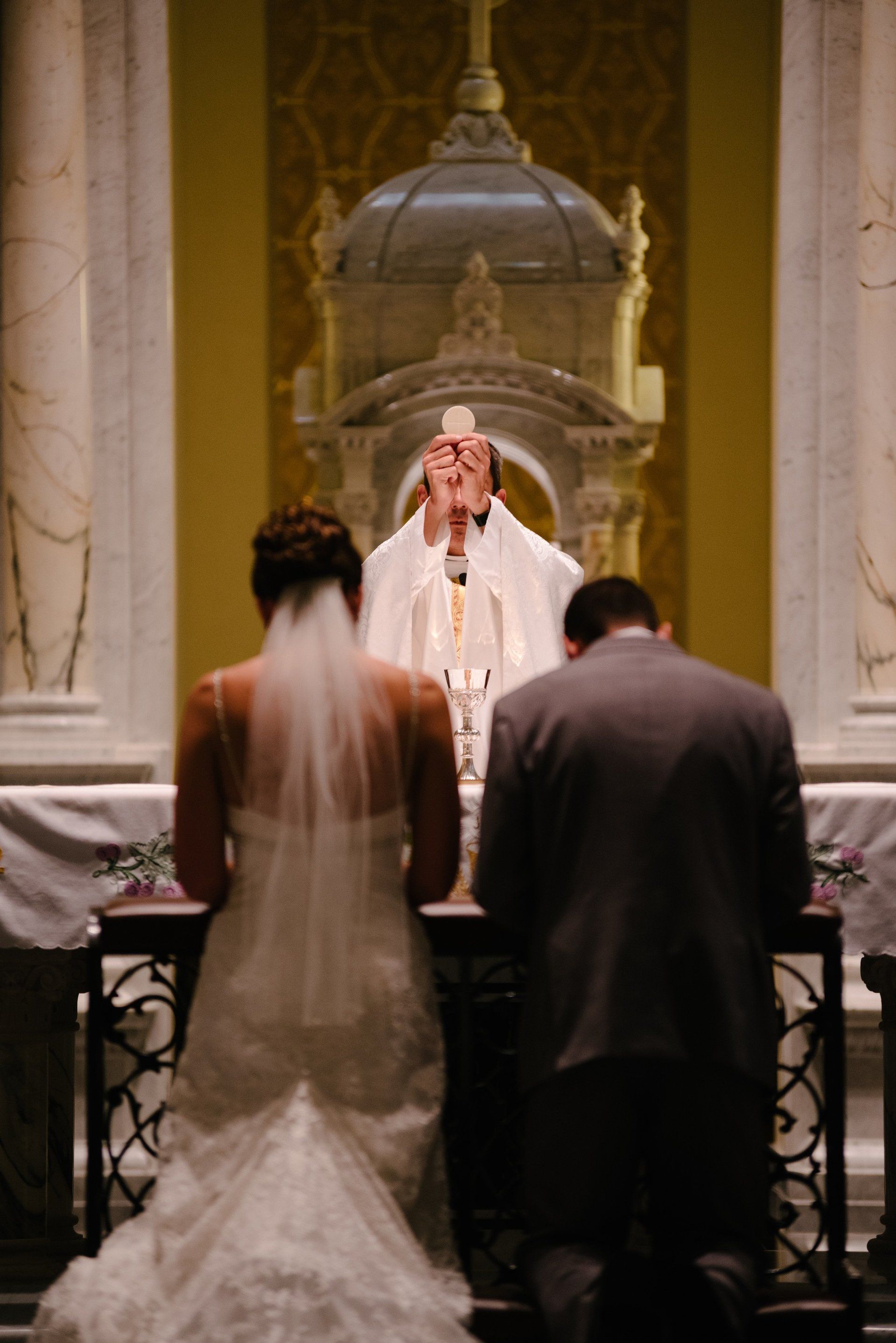 Wedding couple with Eucharist