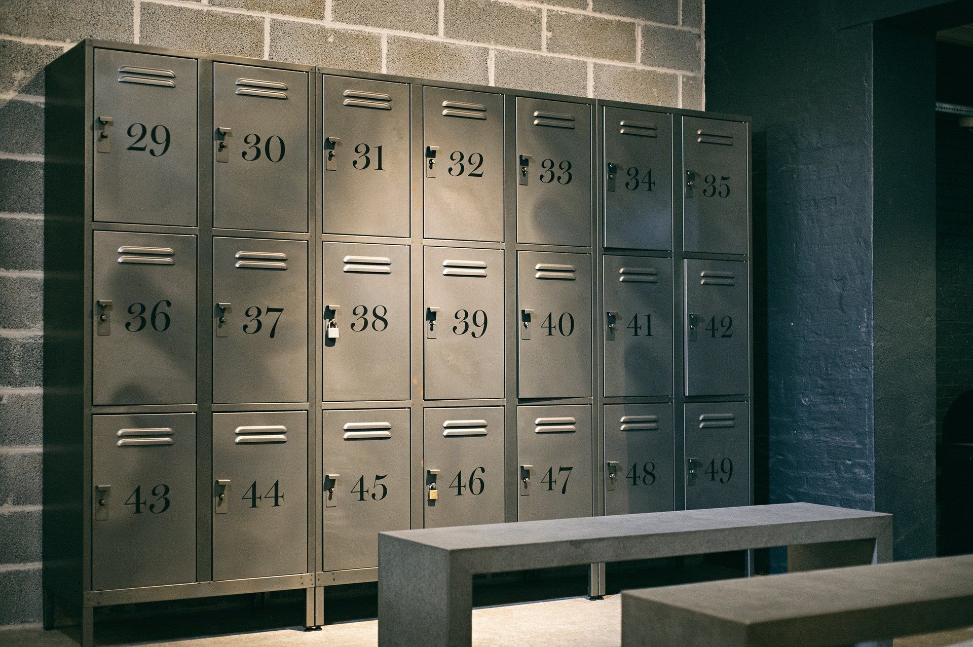 A row of metal lockers with numbers on them