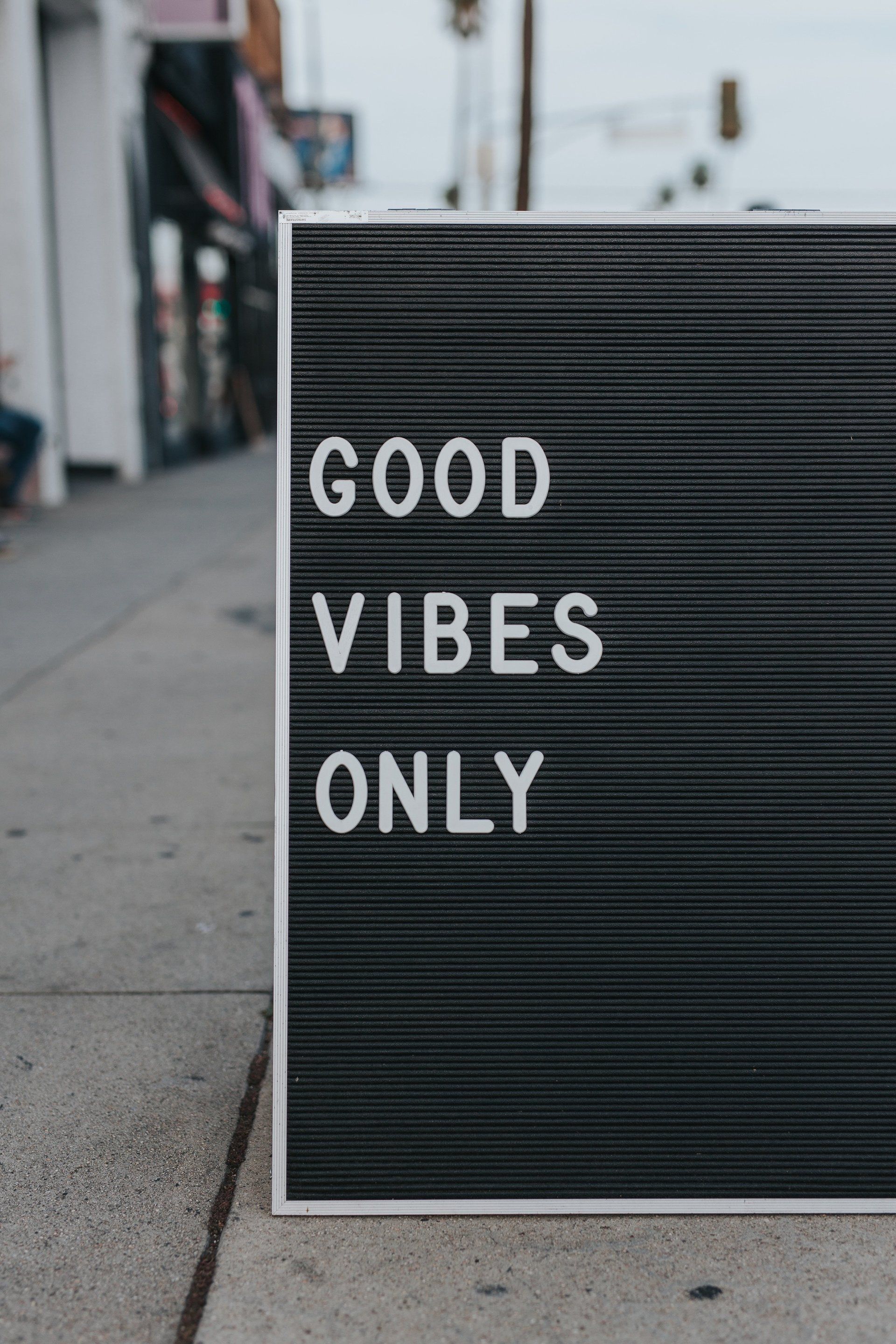 Good Vibes Only - a great sign along a sidewalk