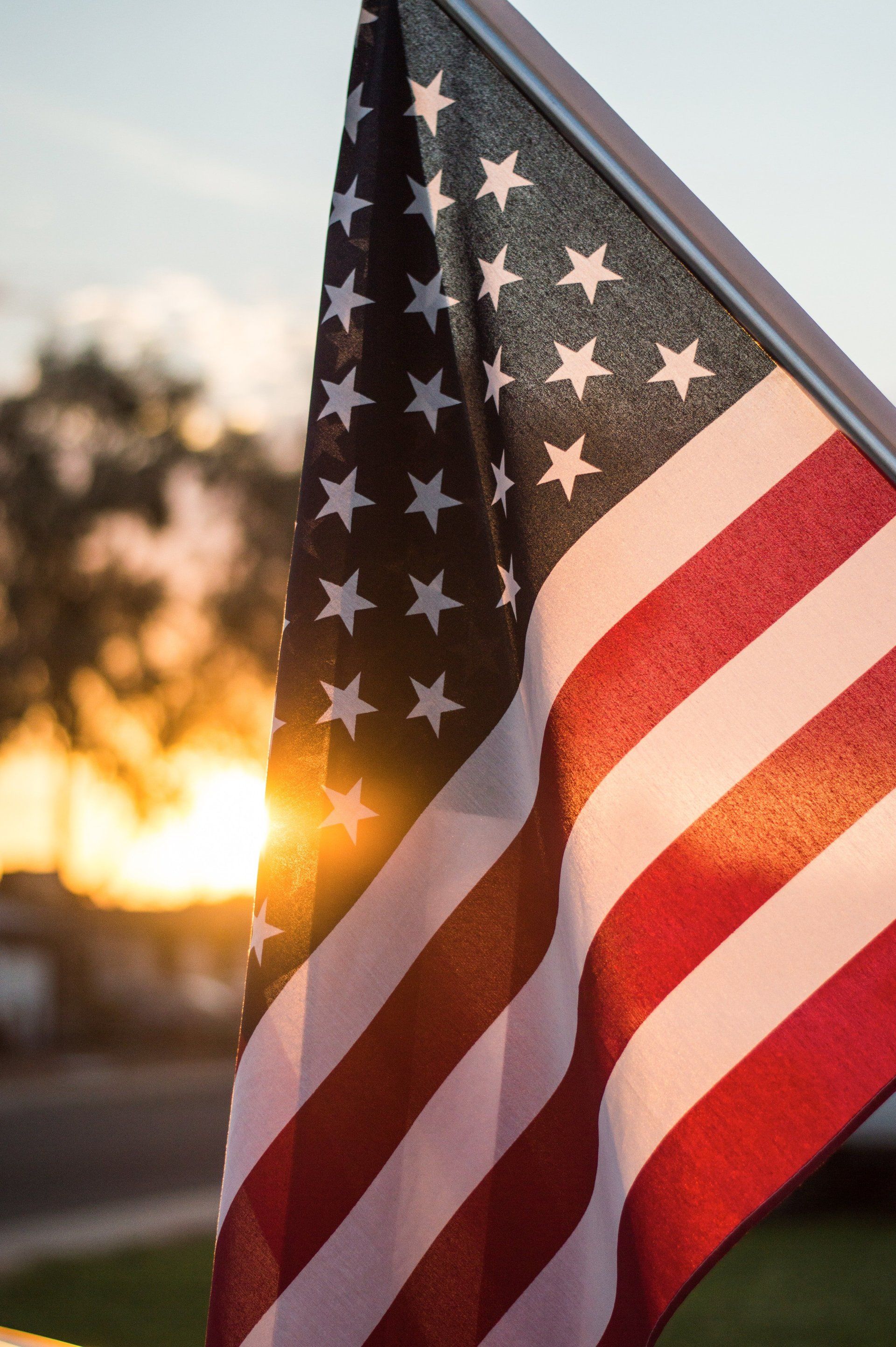 USA Flag at sunrise or sunset