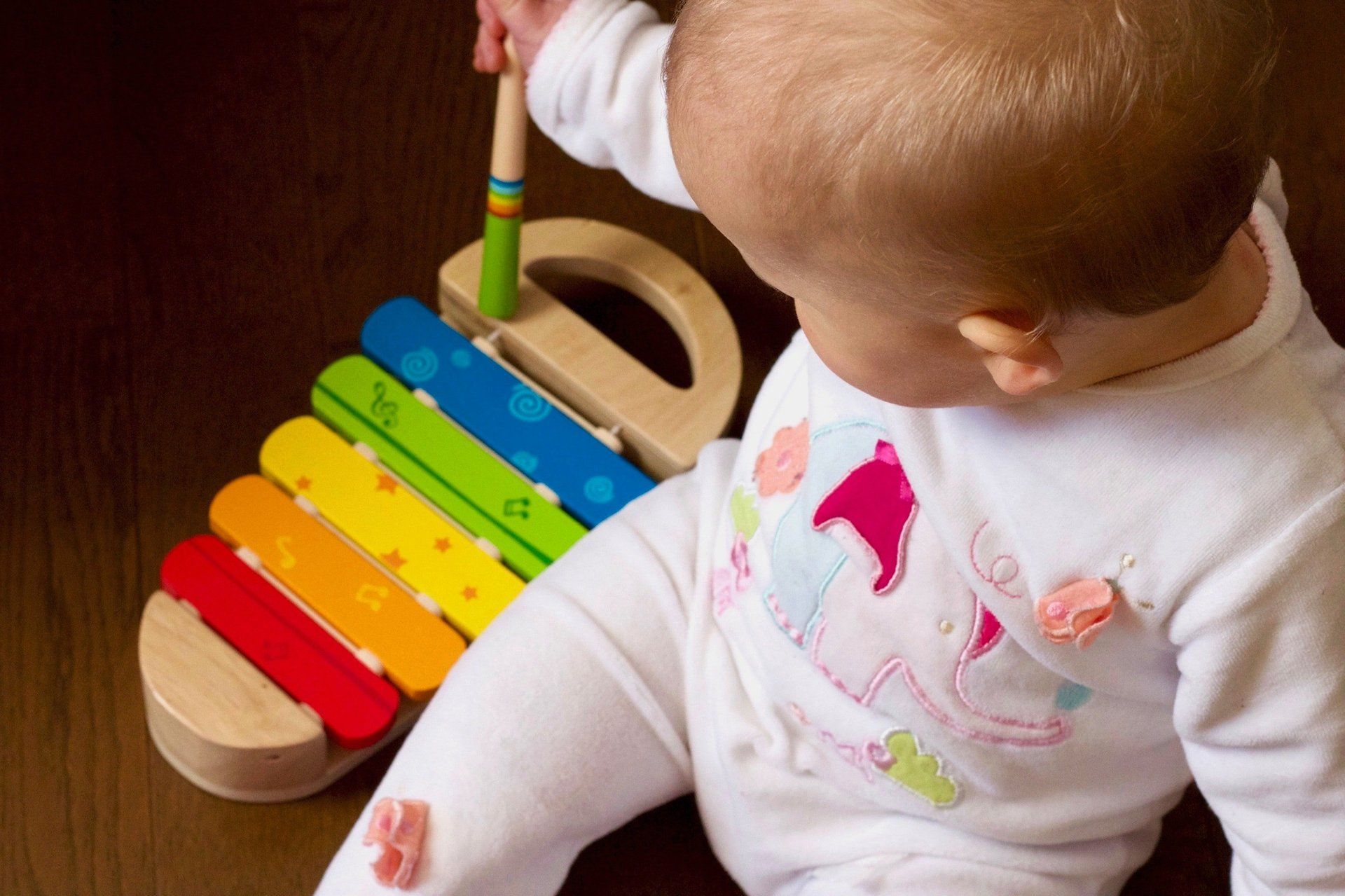 Baby playing with a Xylophone