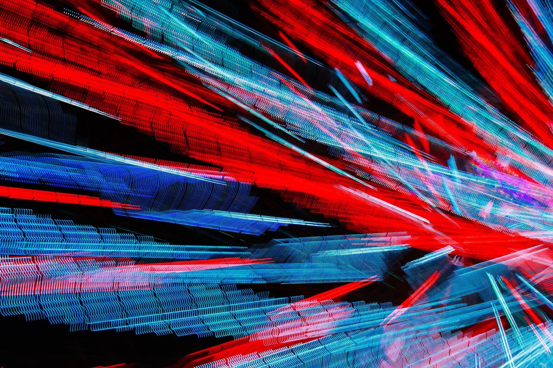 A painting of red , blue and white lines on a black background