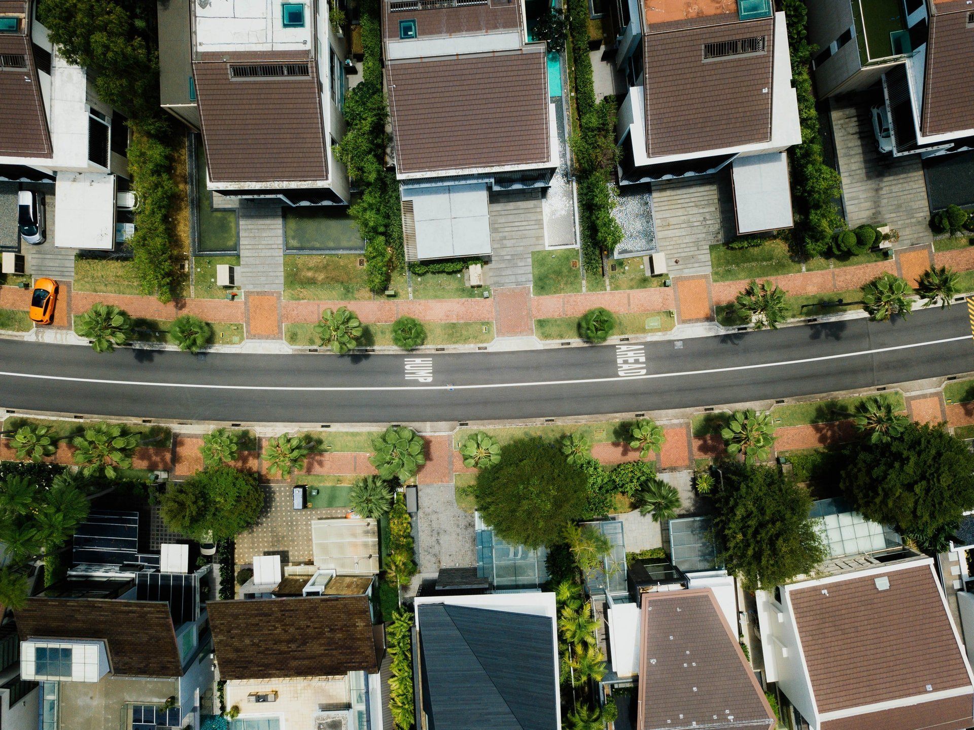 An aerial view of a residential area with lots of houses and trees