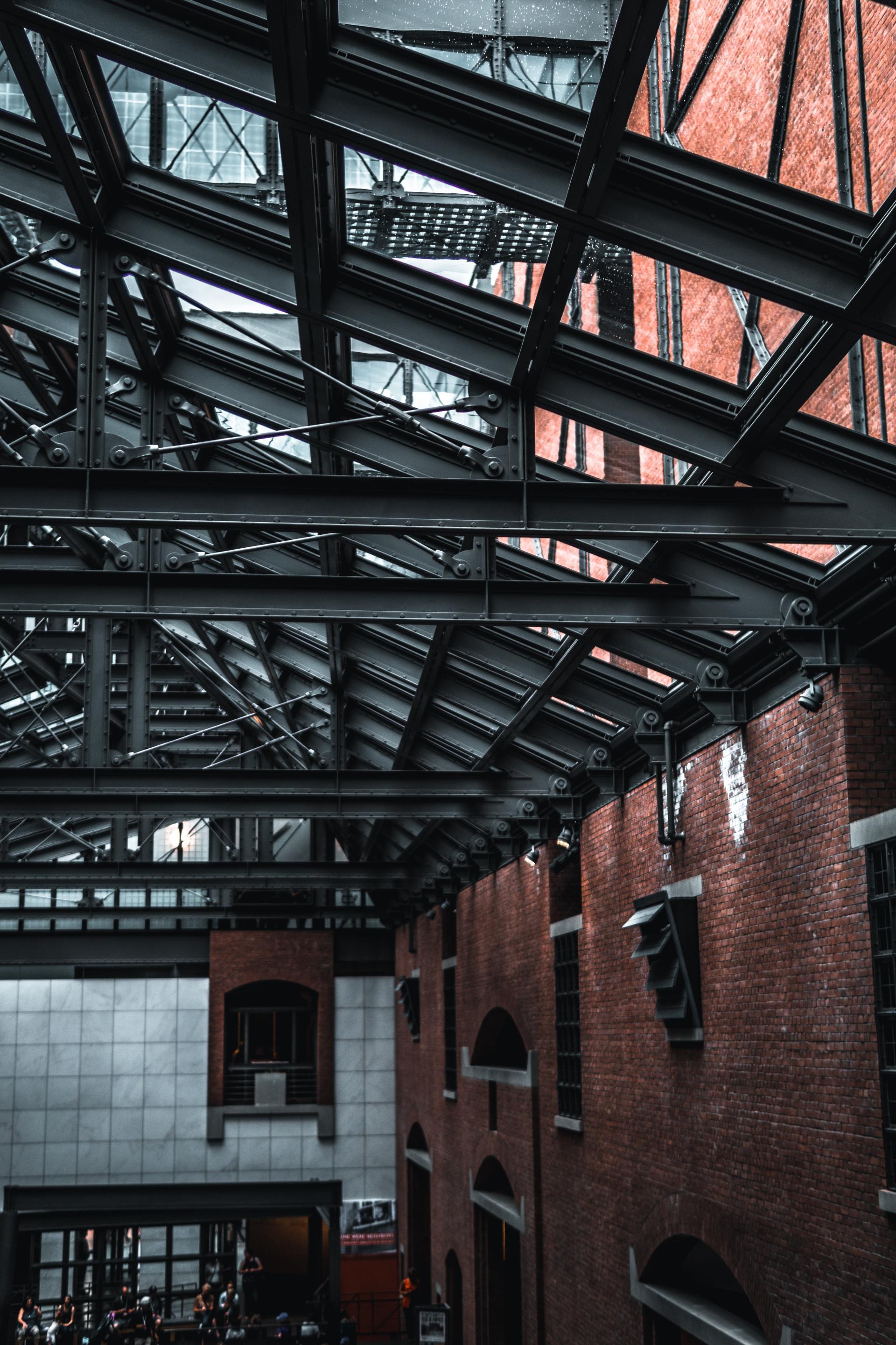 Looking up at the ceiling of a building with a glass roof.