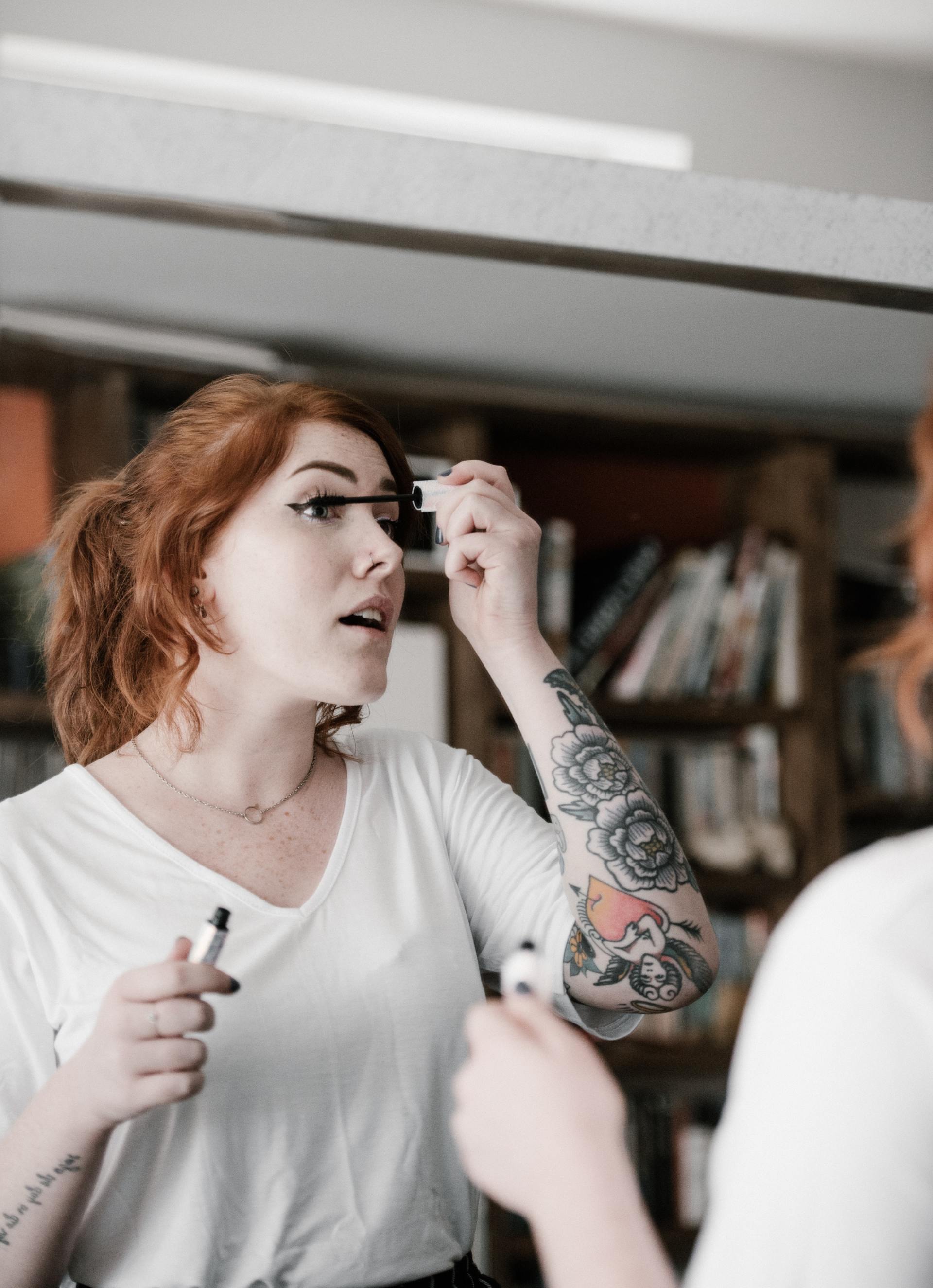 woman applying mascara