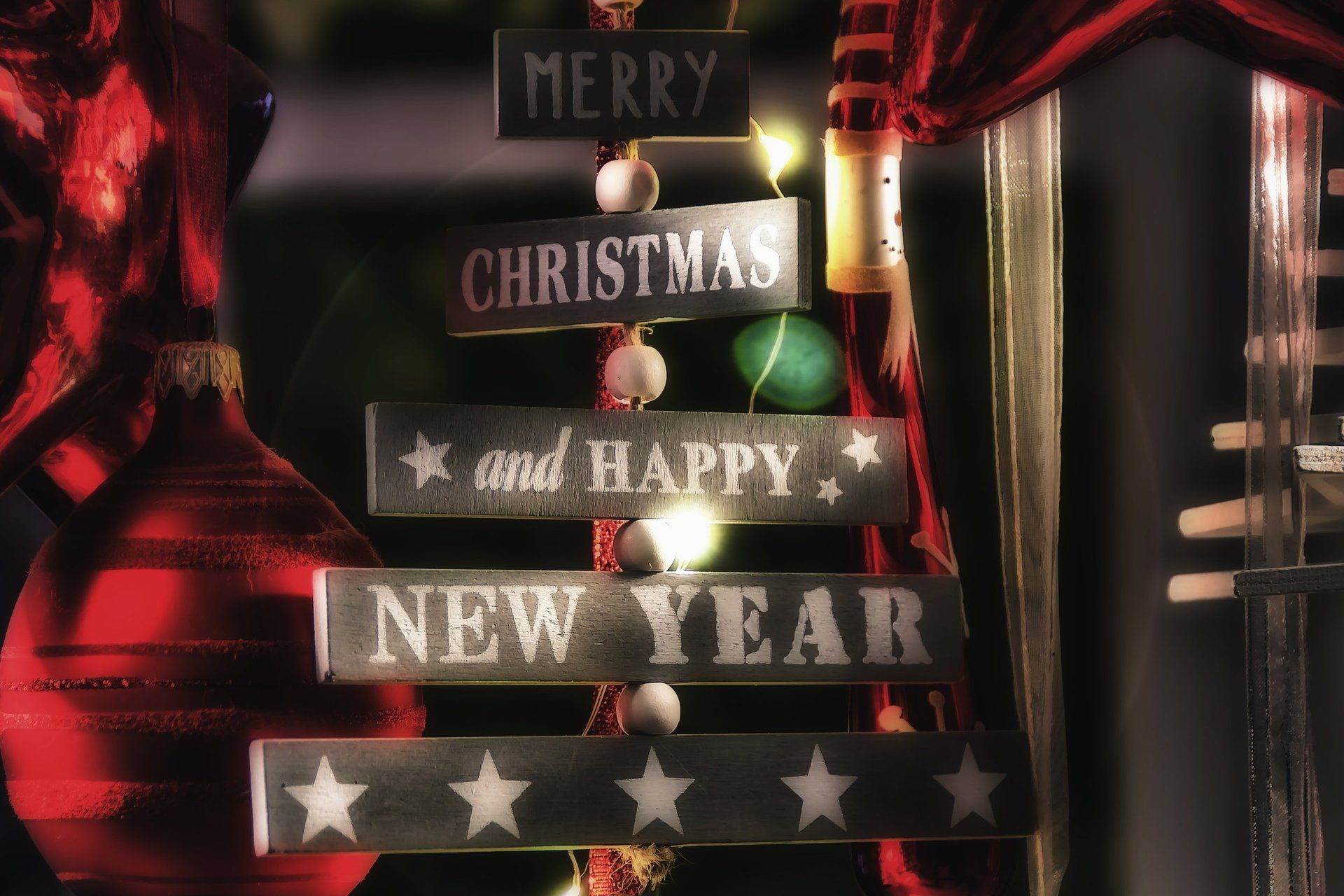 Wooden sign with Merry Christmas and Happy New Year boards