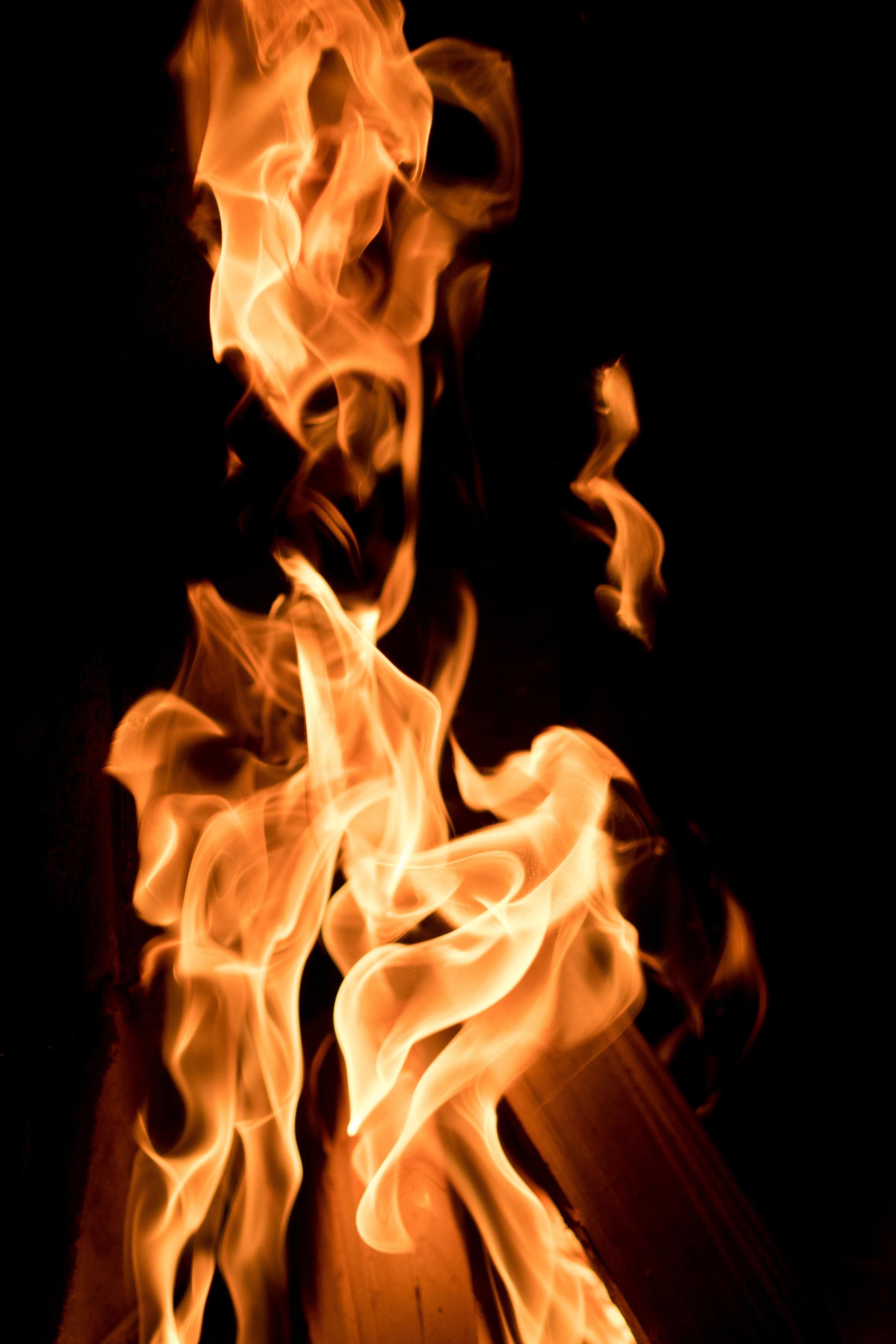 A close up of a fire on a black background.