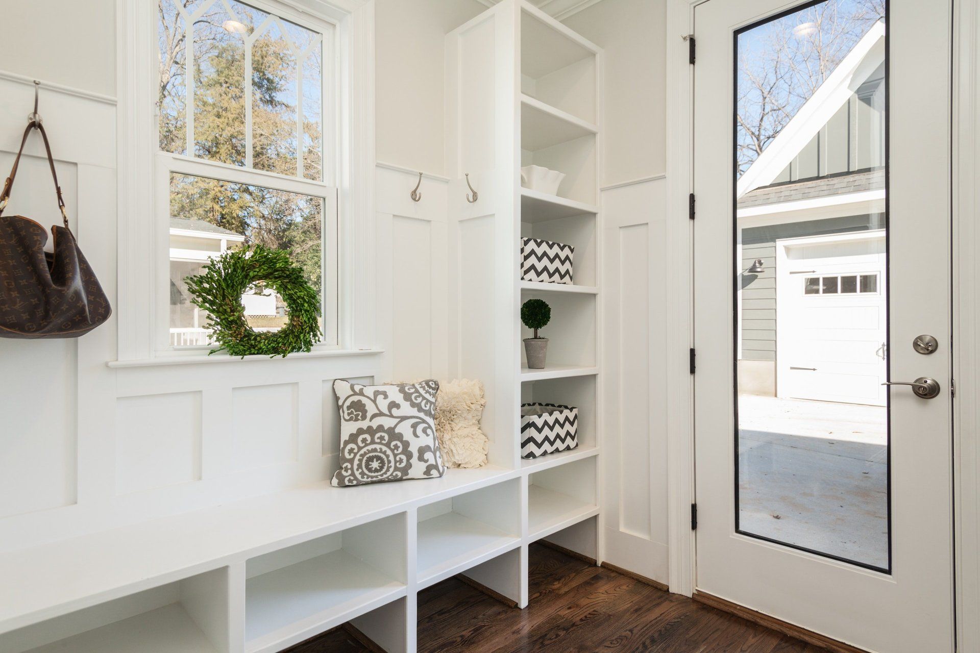 Beautiful white entry-way/mud room with cubby storage