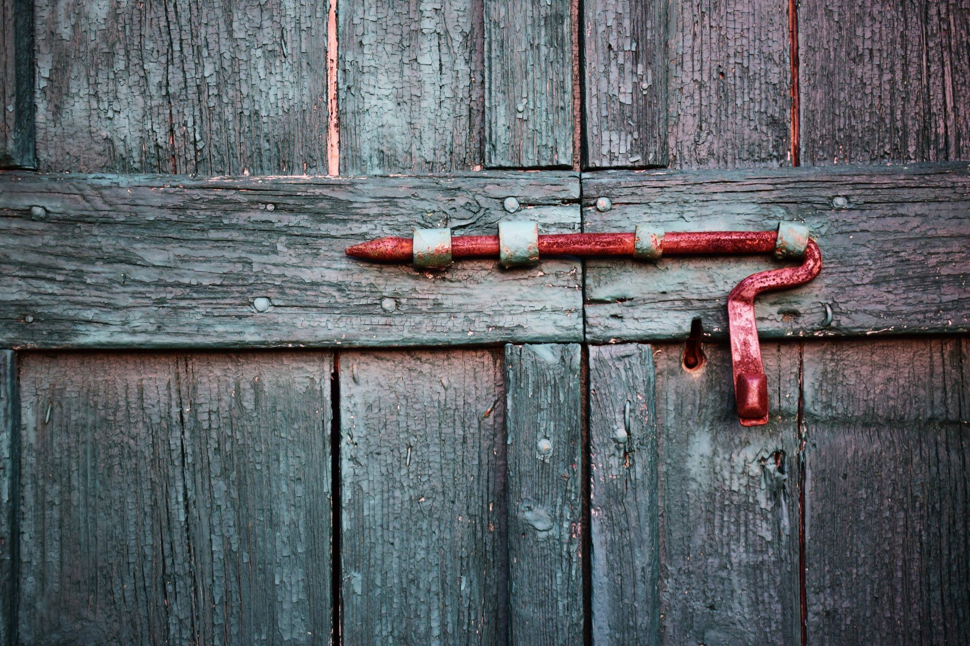 Old wooden barn door with latch