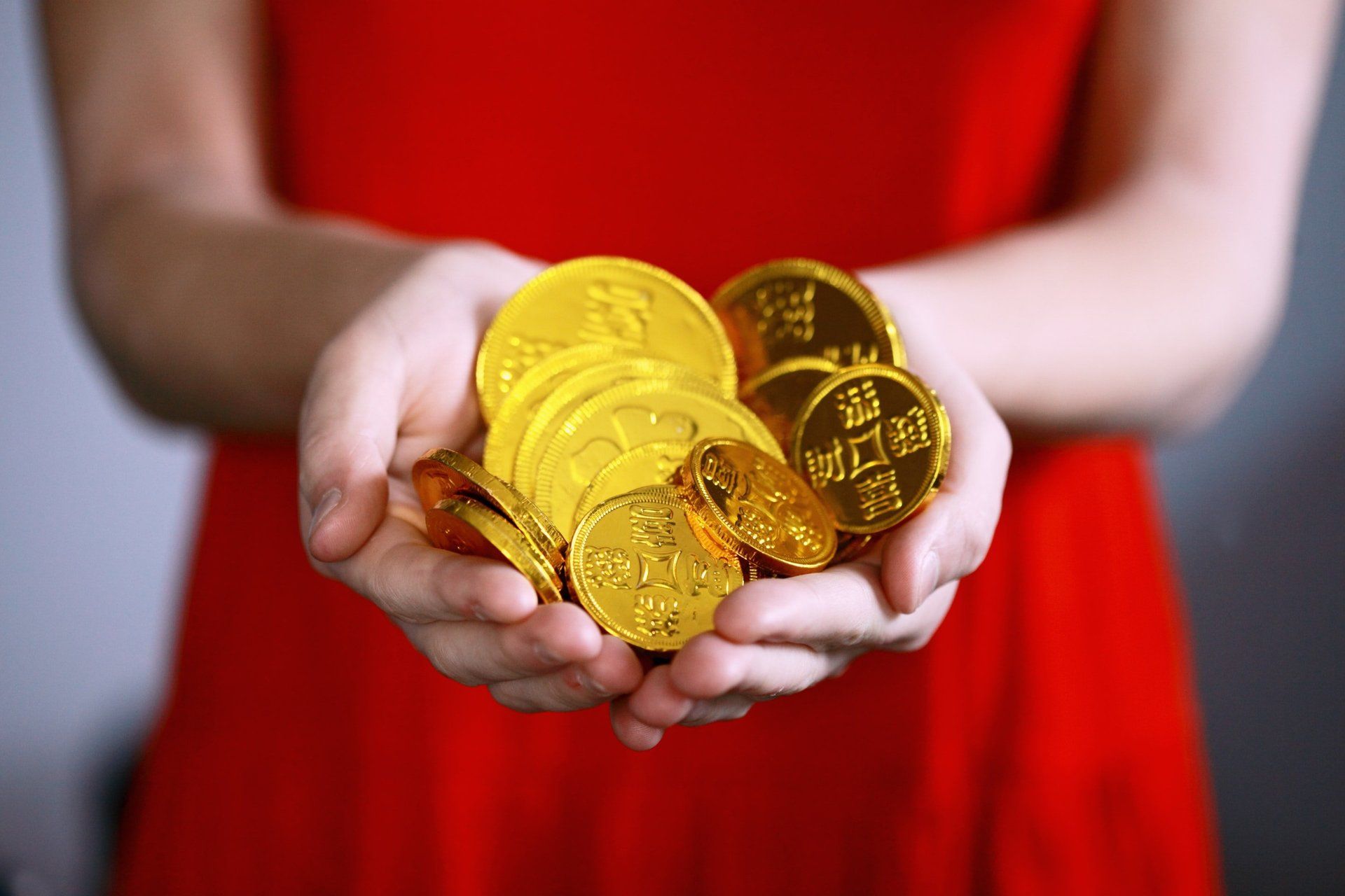 Holding gold coins