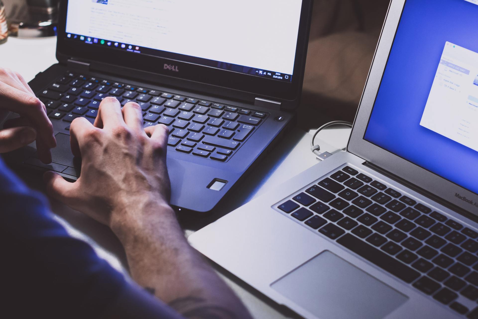 guy typing on laptop computer