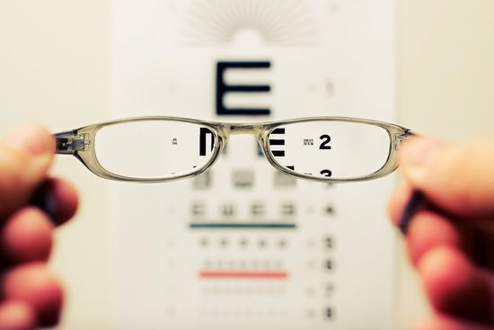 Optometrist testing the eyes