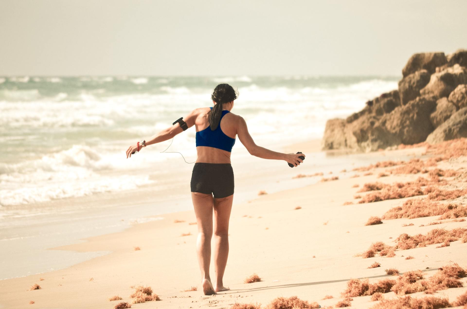 woman running on the beach