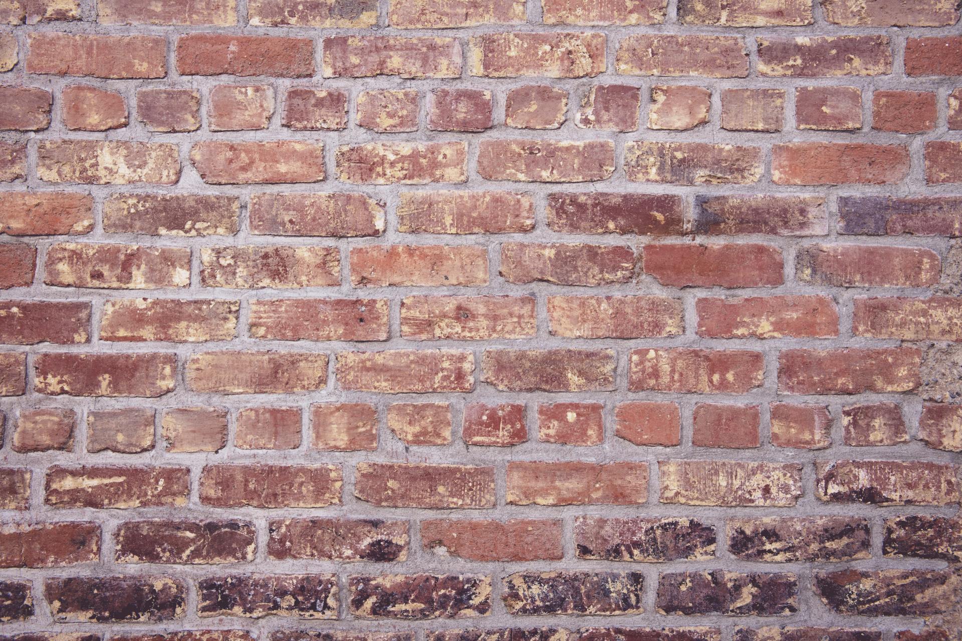A close up of a brick wall with a lot of bricks