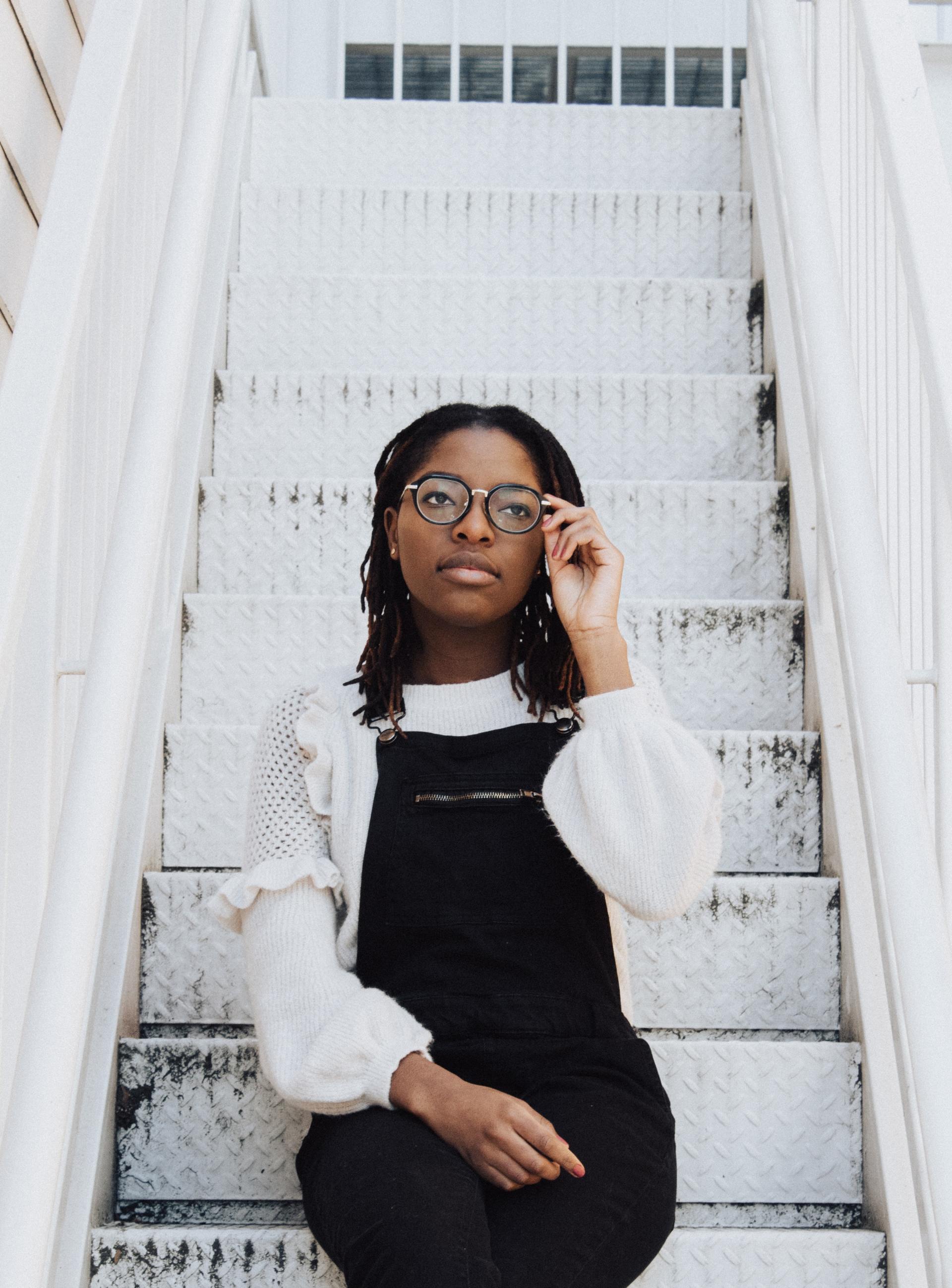 A woman sitting on stairs