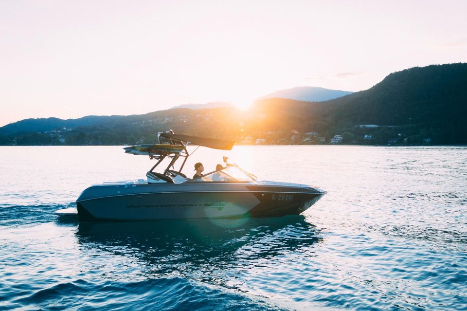 Motor boat on a lake at sunset