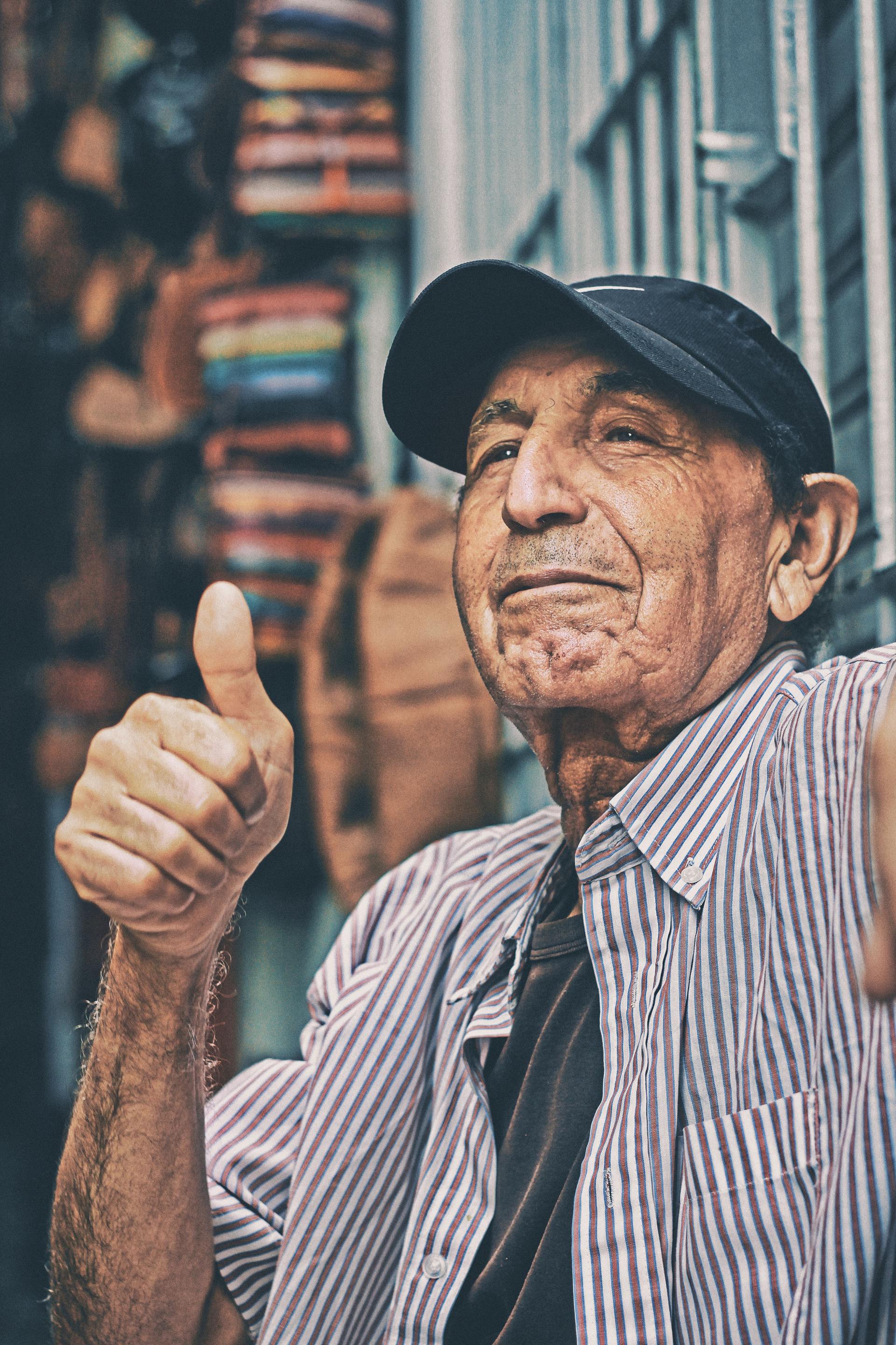 old man giving thumbs up