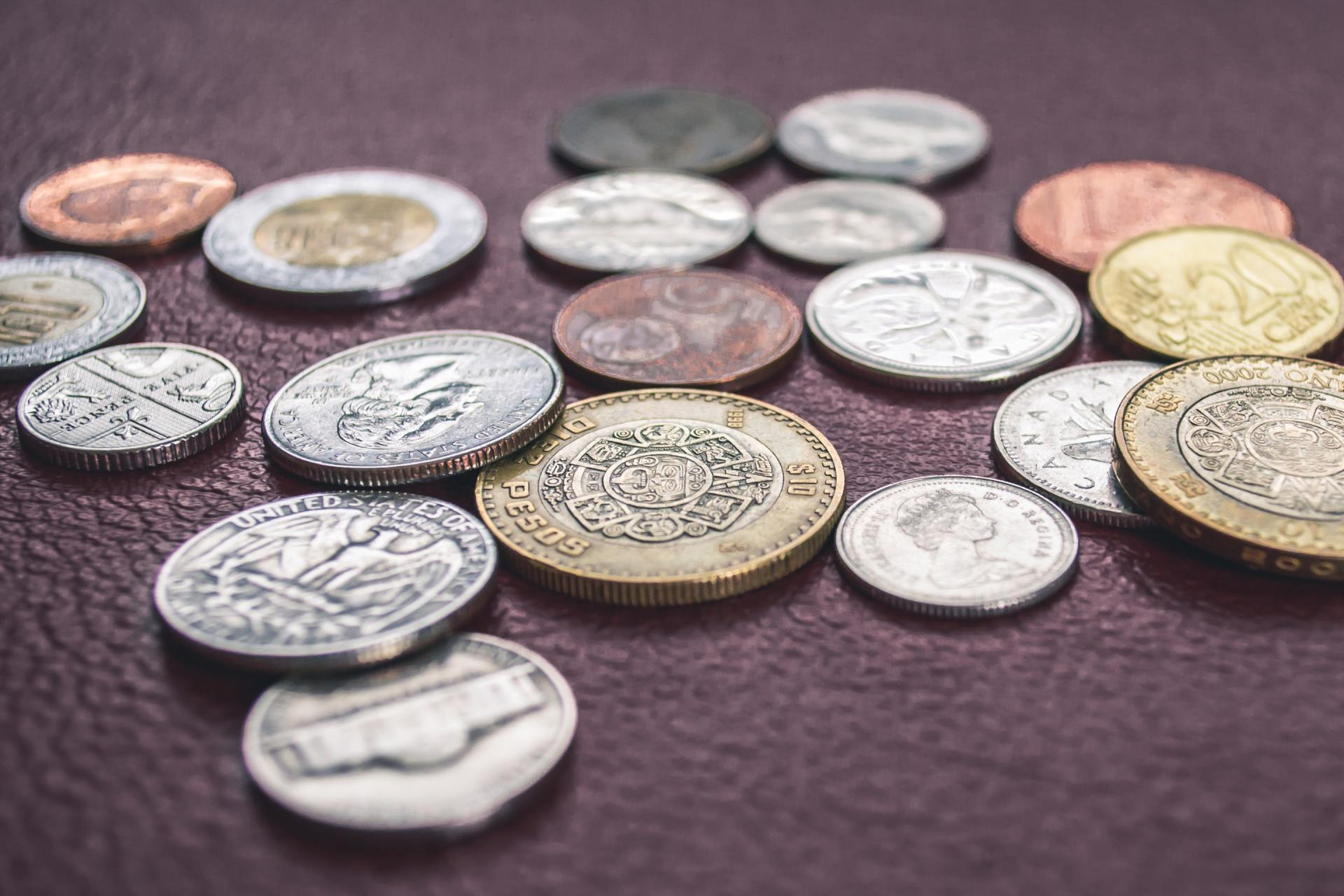 Photograph of coins on a textured purple surface
