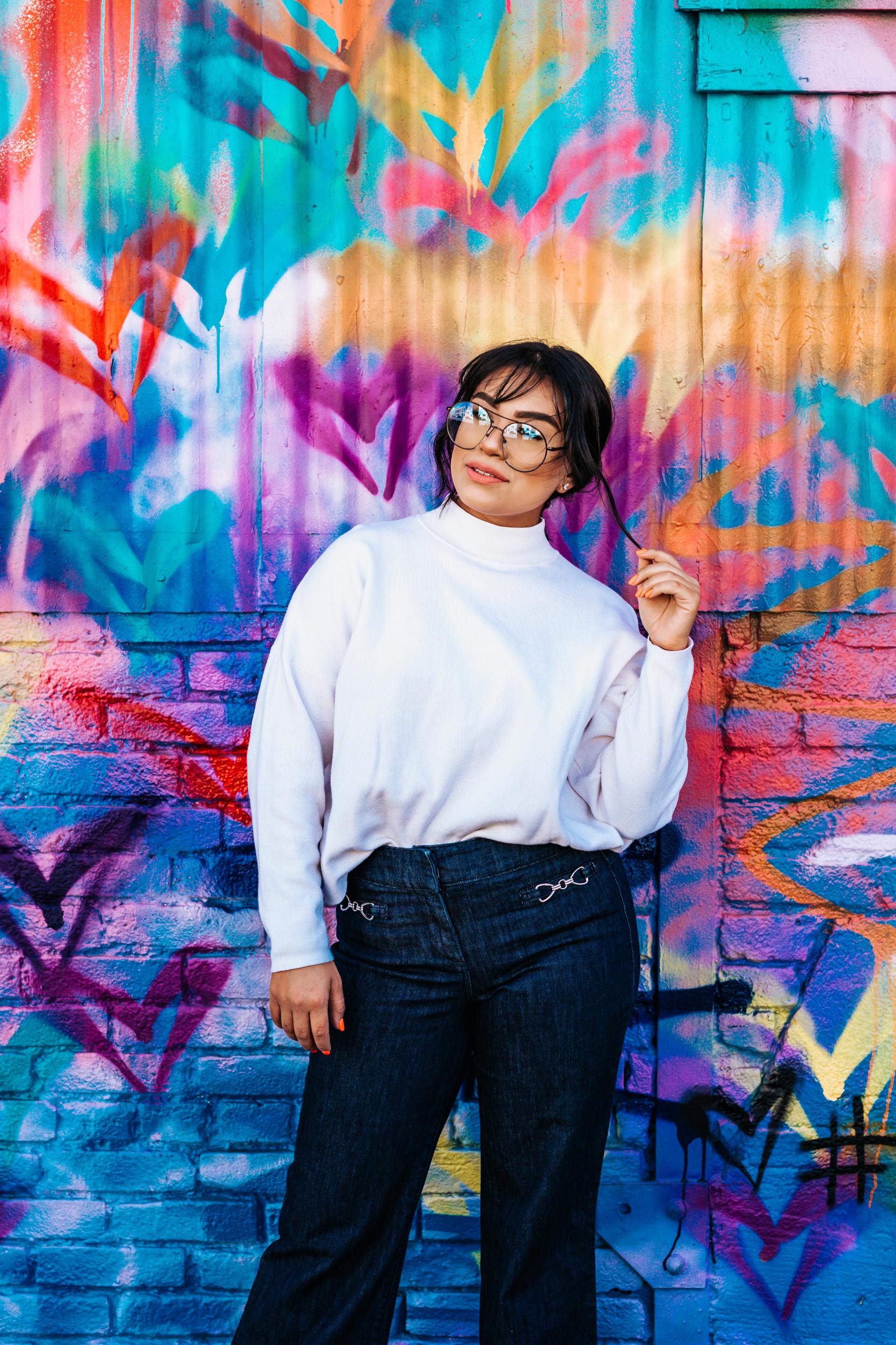 A Girl standing with a colorful background