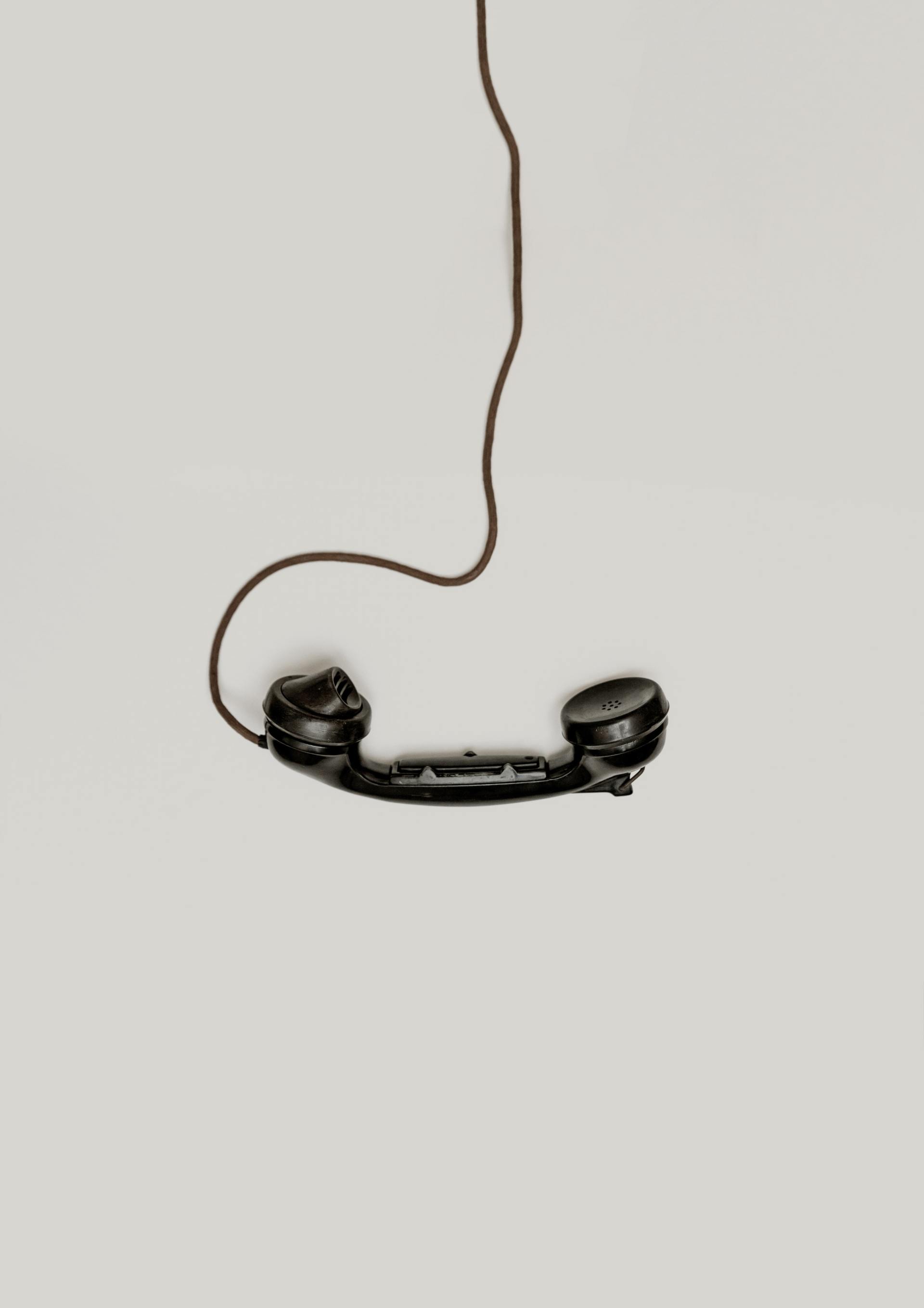 phone handset dangling off cord