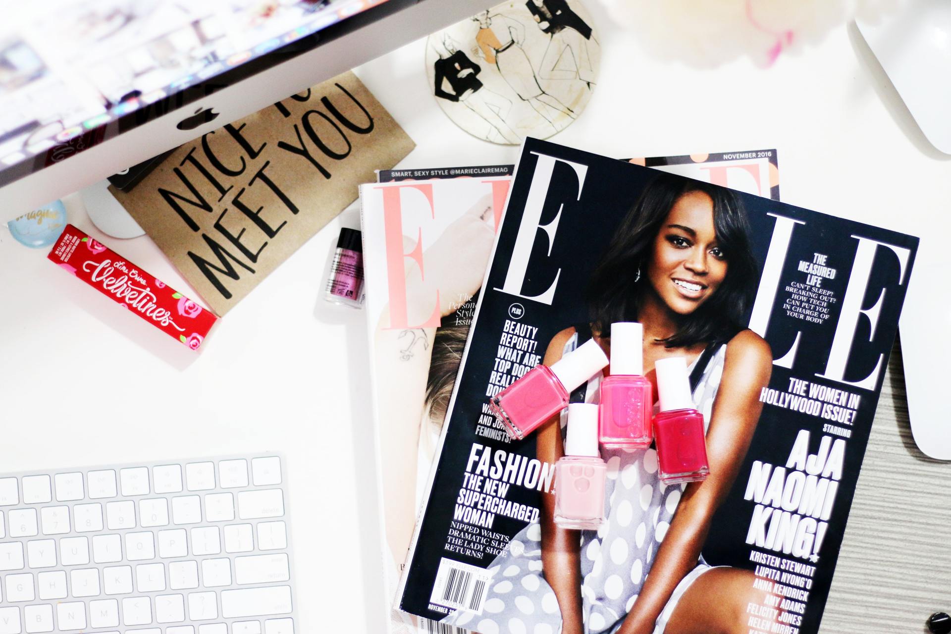 A magazine with a woman on the cover and a sign that says nice meet you