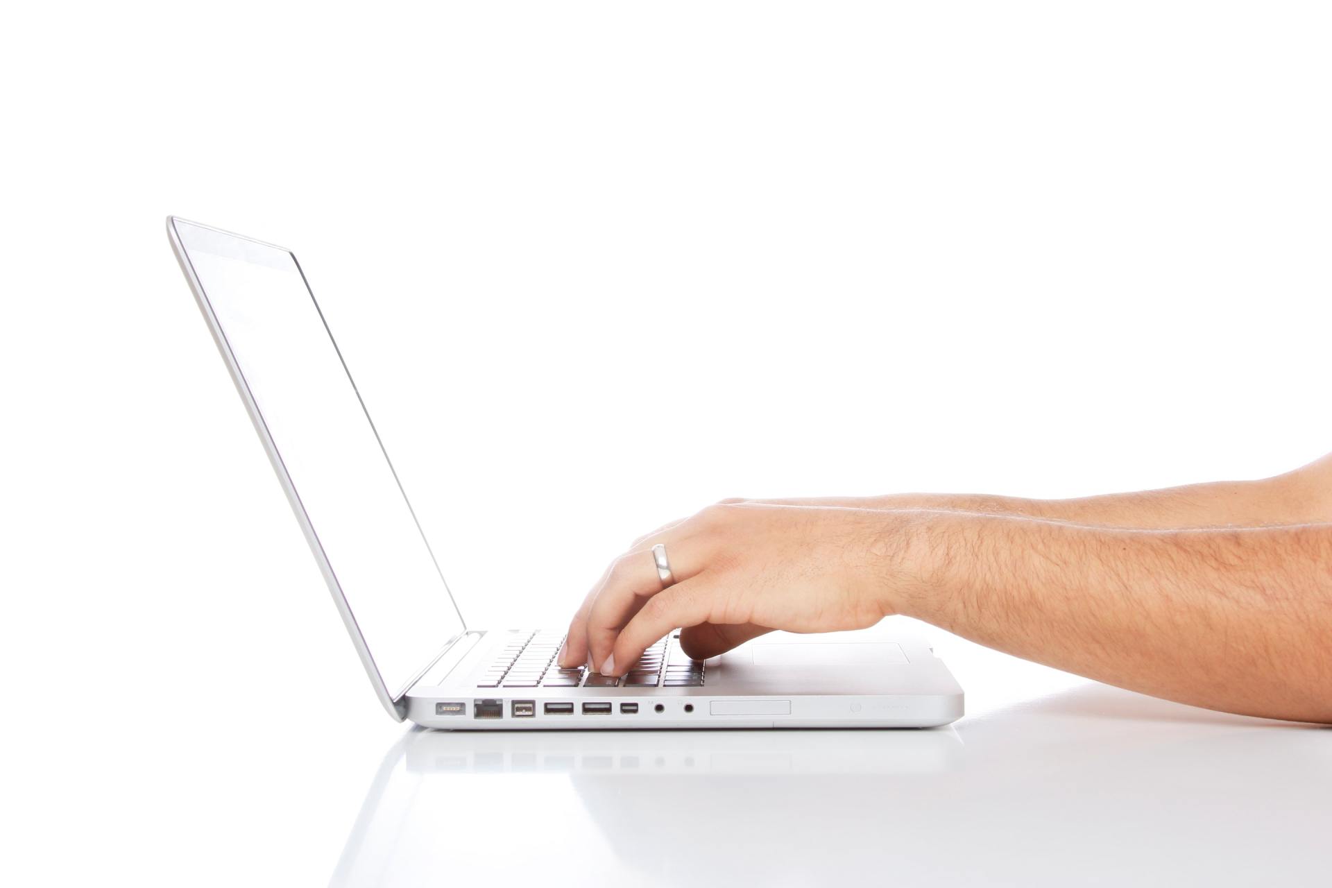 person typing on a computer