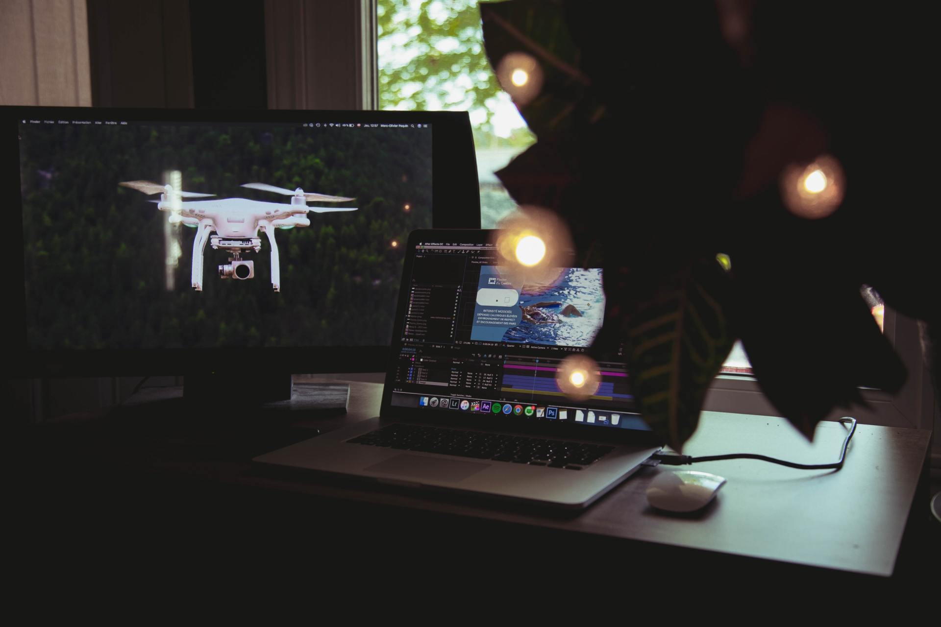 A drone is displayed on a computer screen next to a laptop