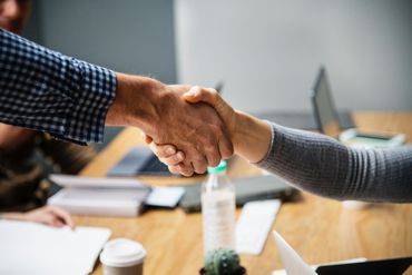 handshake between customer and lawyer