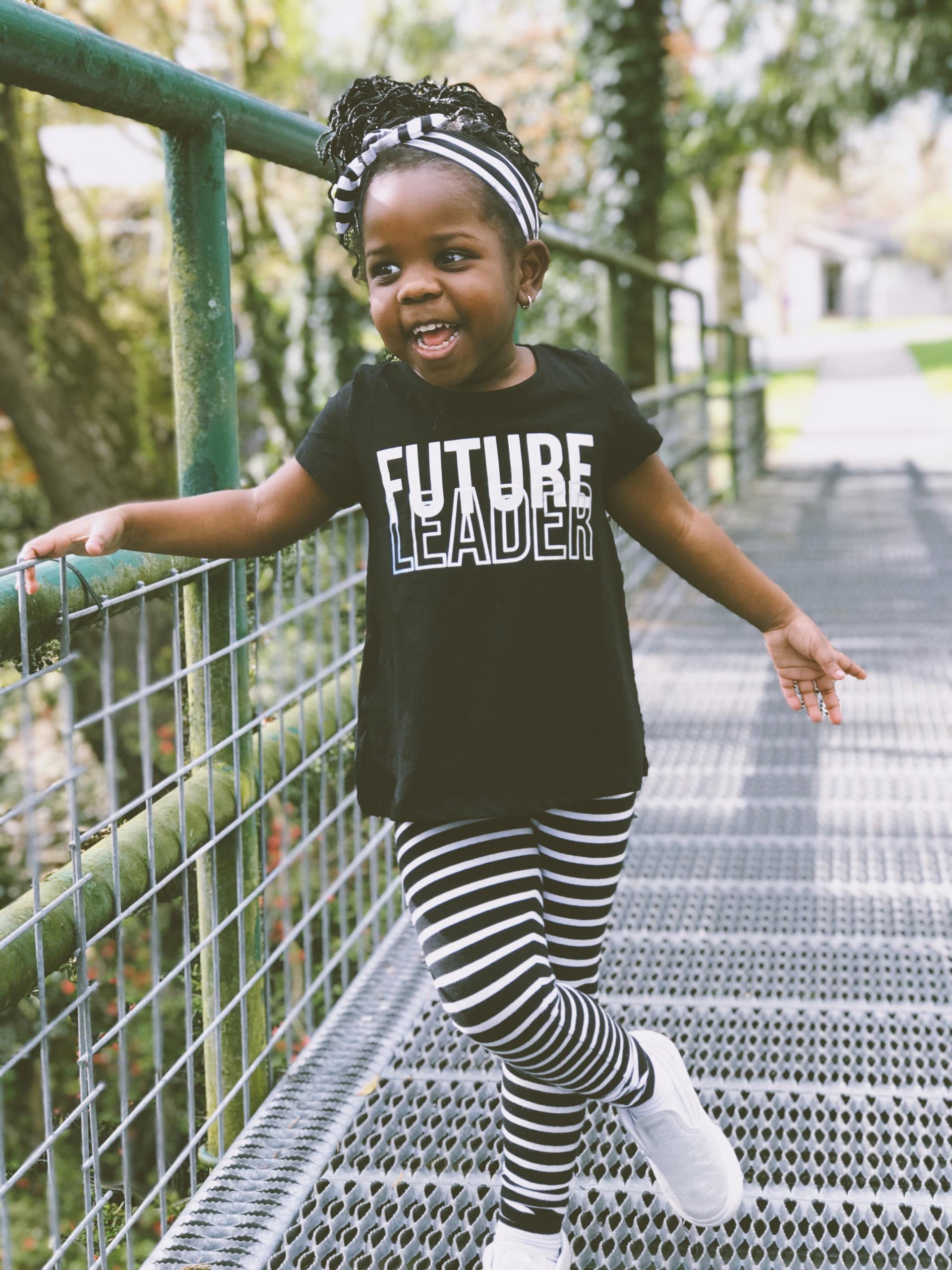 Littler girl smiles wearing