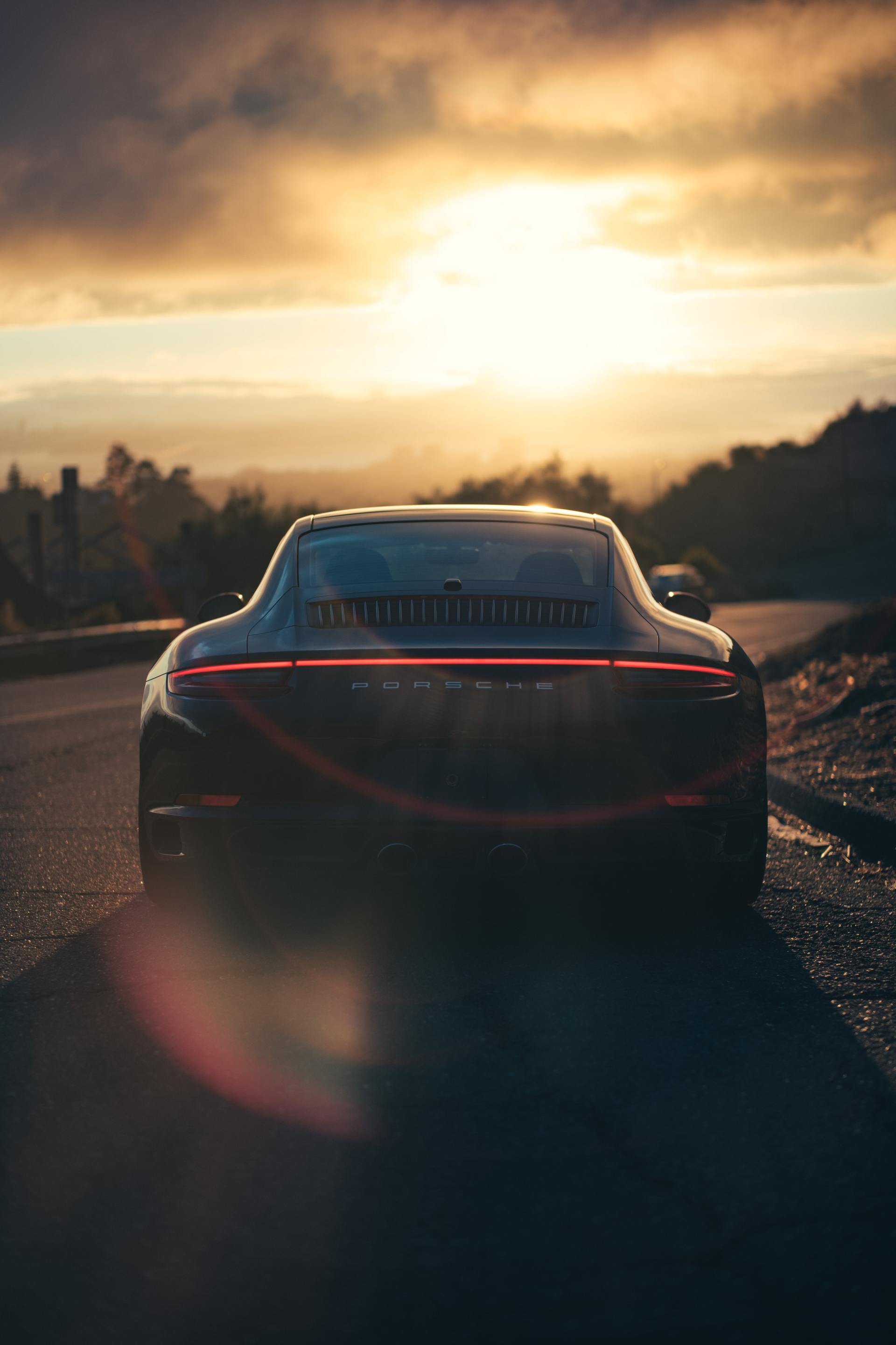 black Porsche in sunset