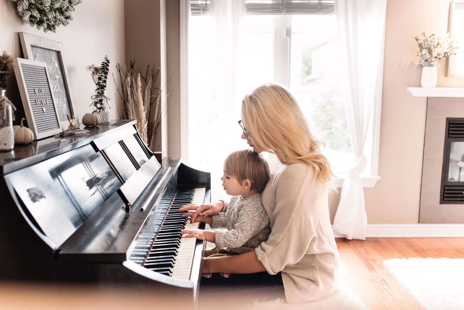 Woman and child at a piano