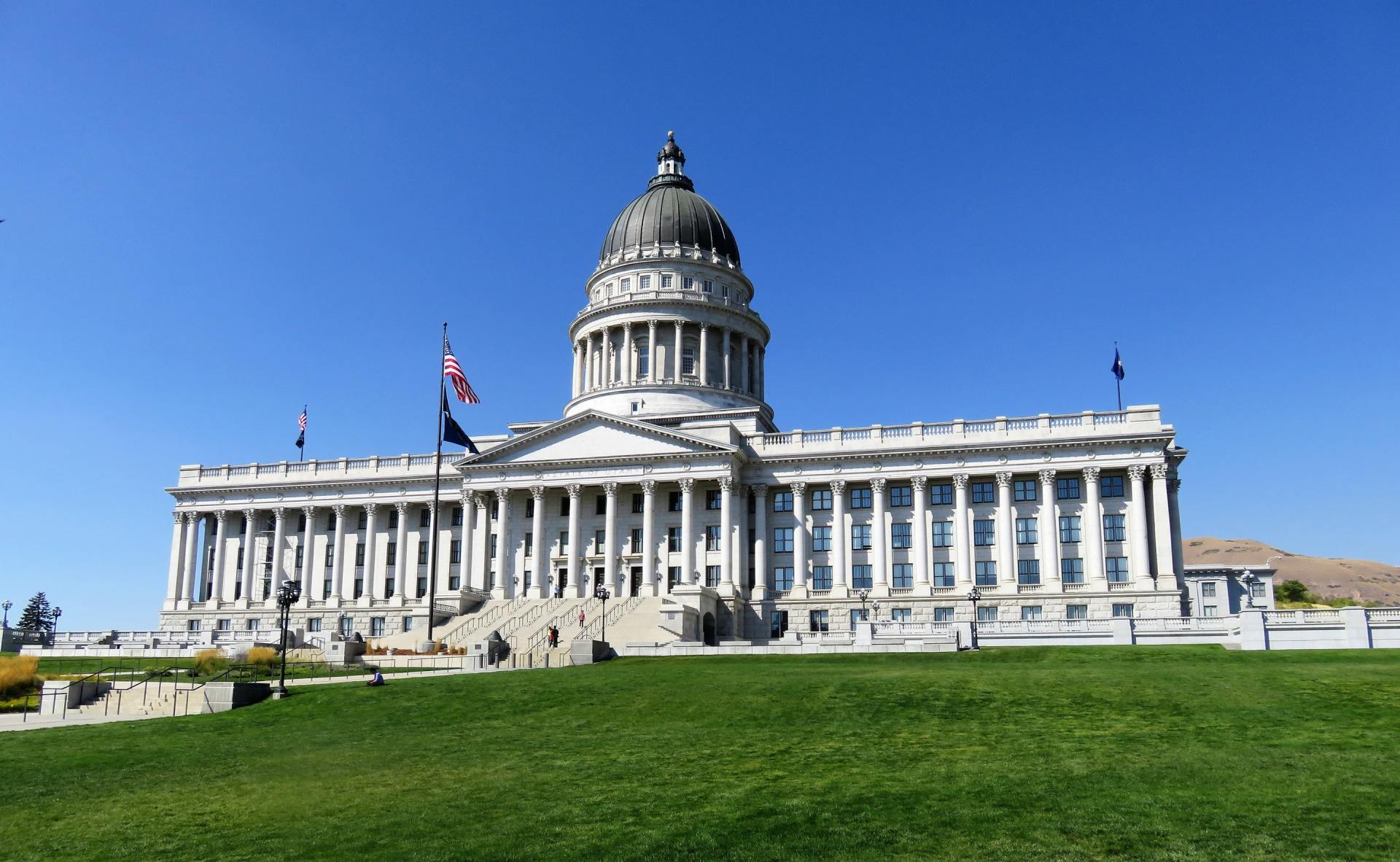 A large white building with a dome on top of it