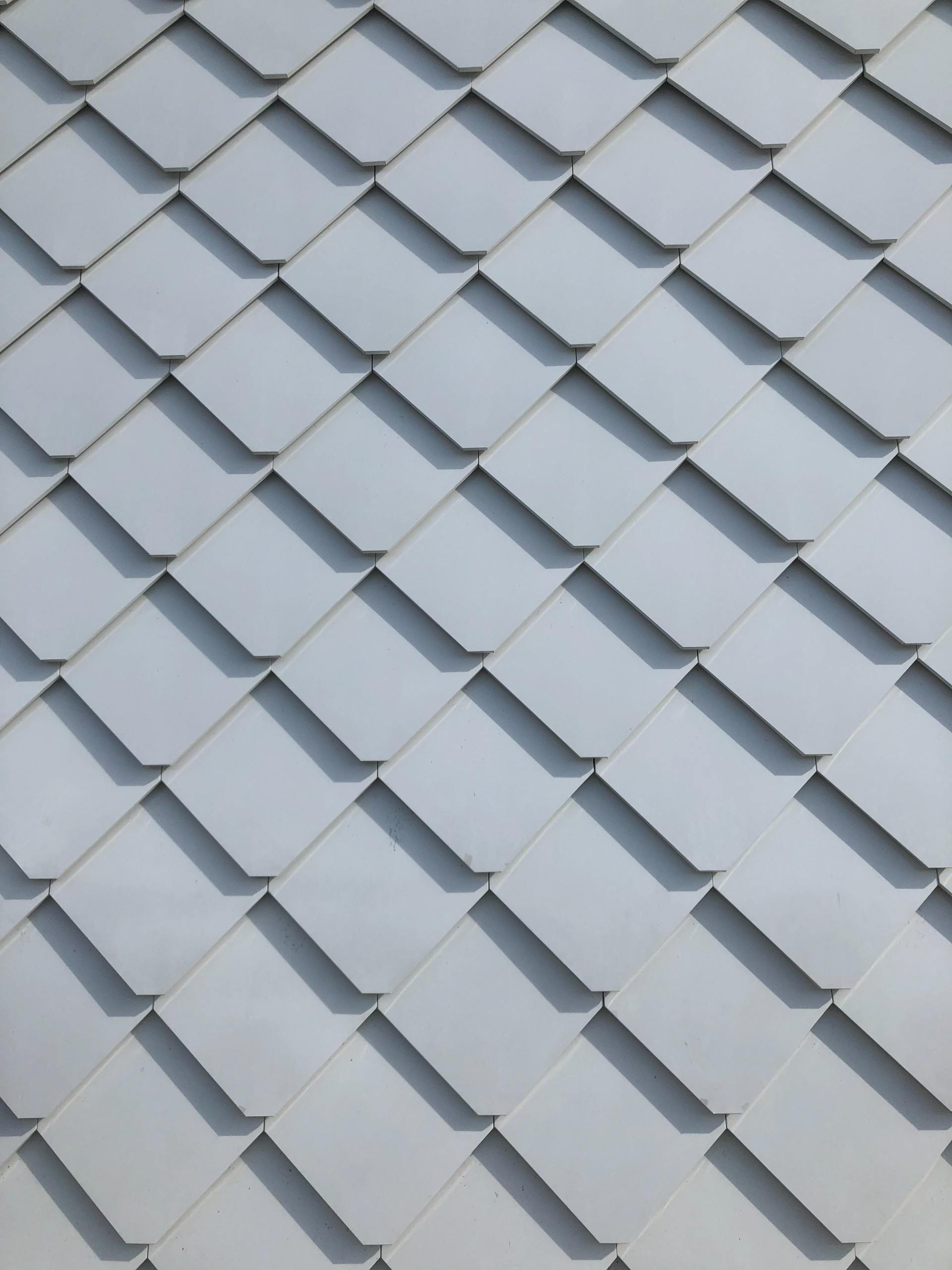 A close up of a white roof with a diagonal pattern