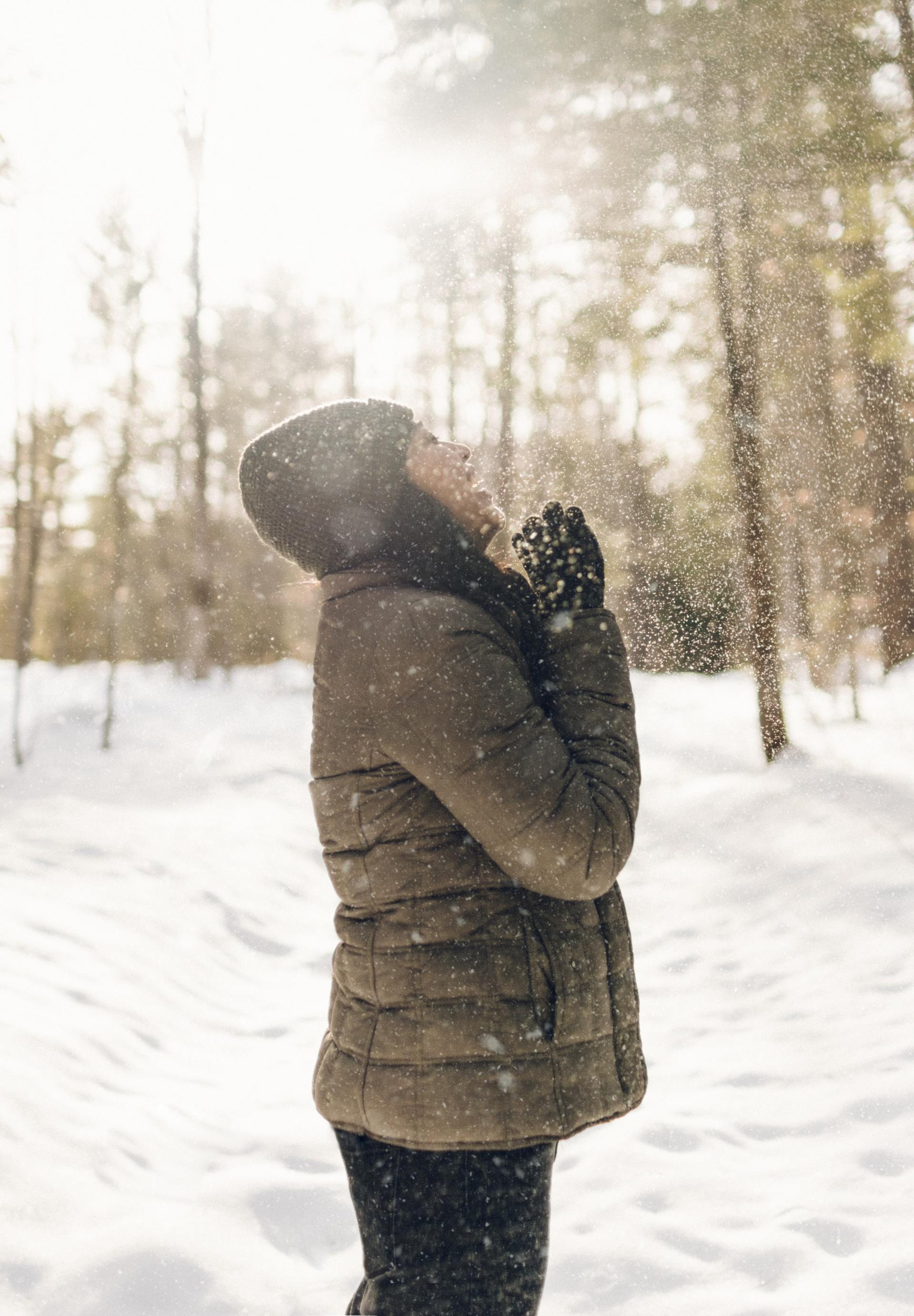 Women laughing as snow falls