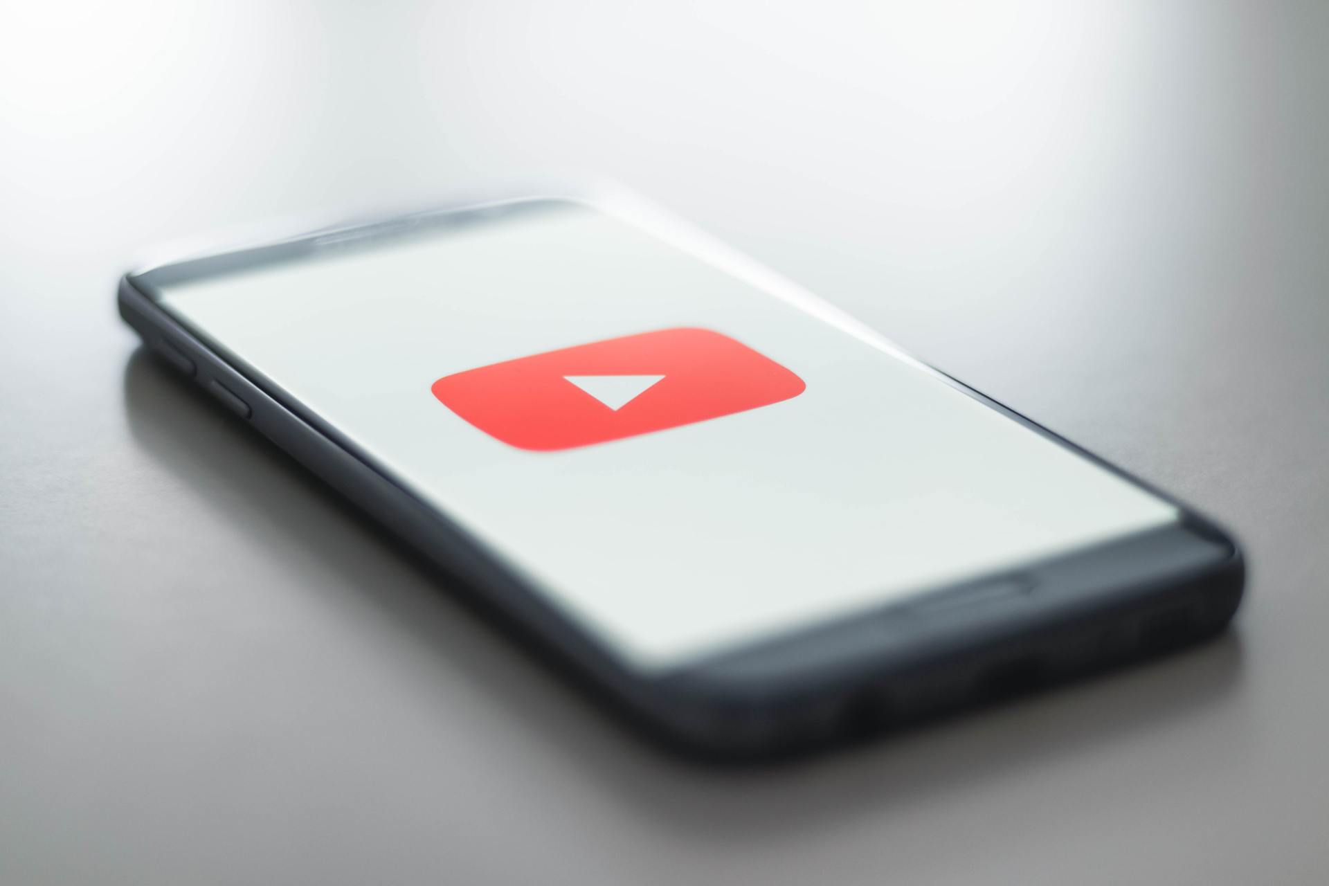 Youtube logo on mobile phone screen