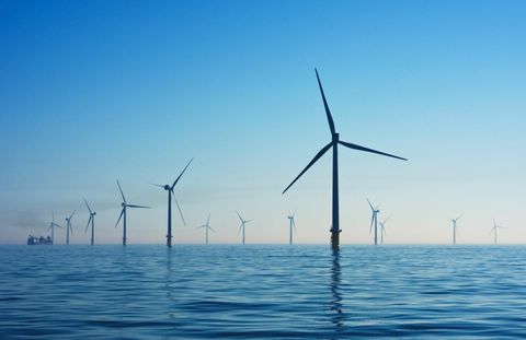 wind farm on ocean with large turbines