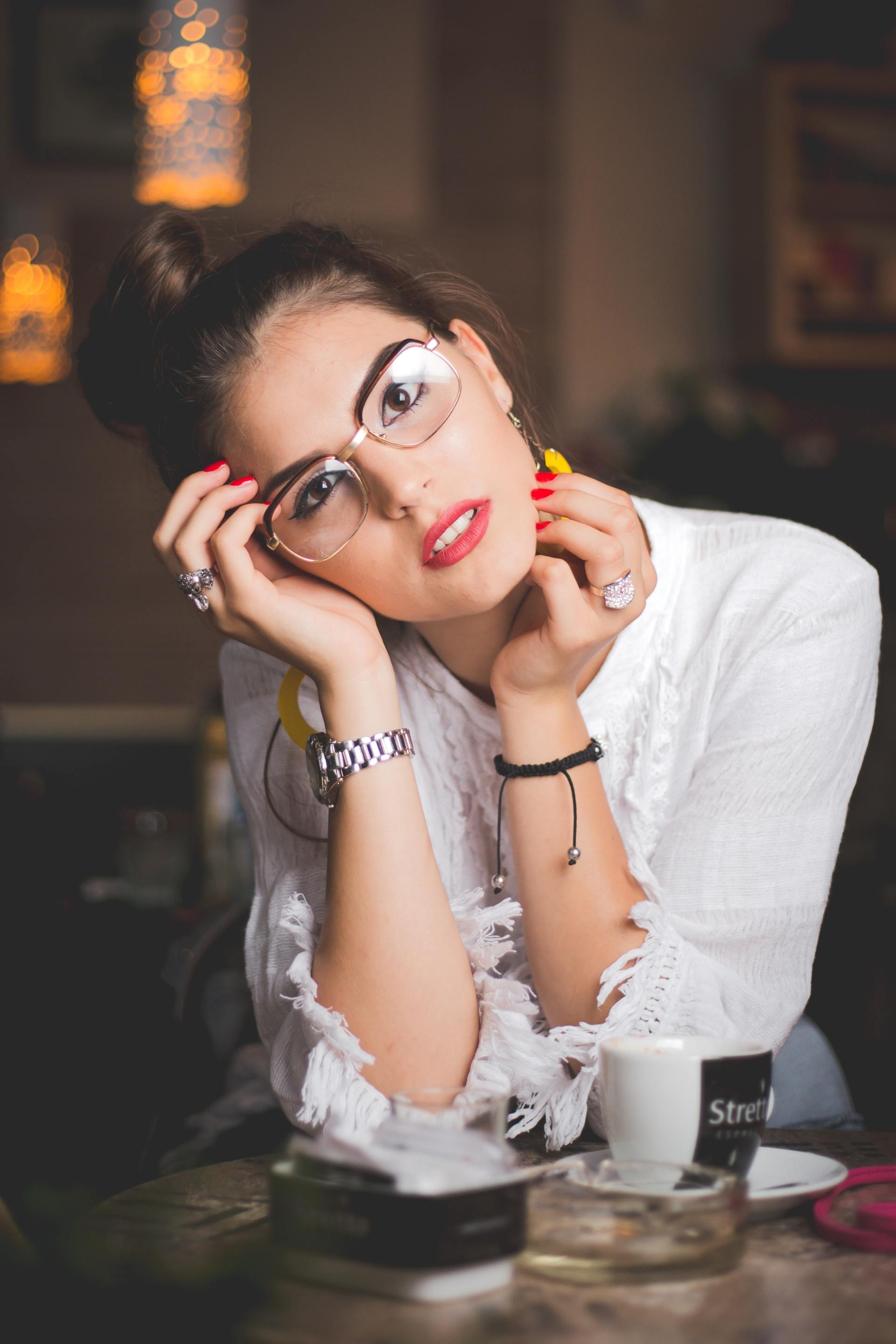 A woman in prescription eyewear to correct farsightedness