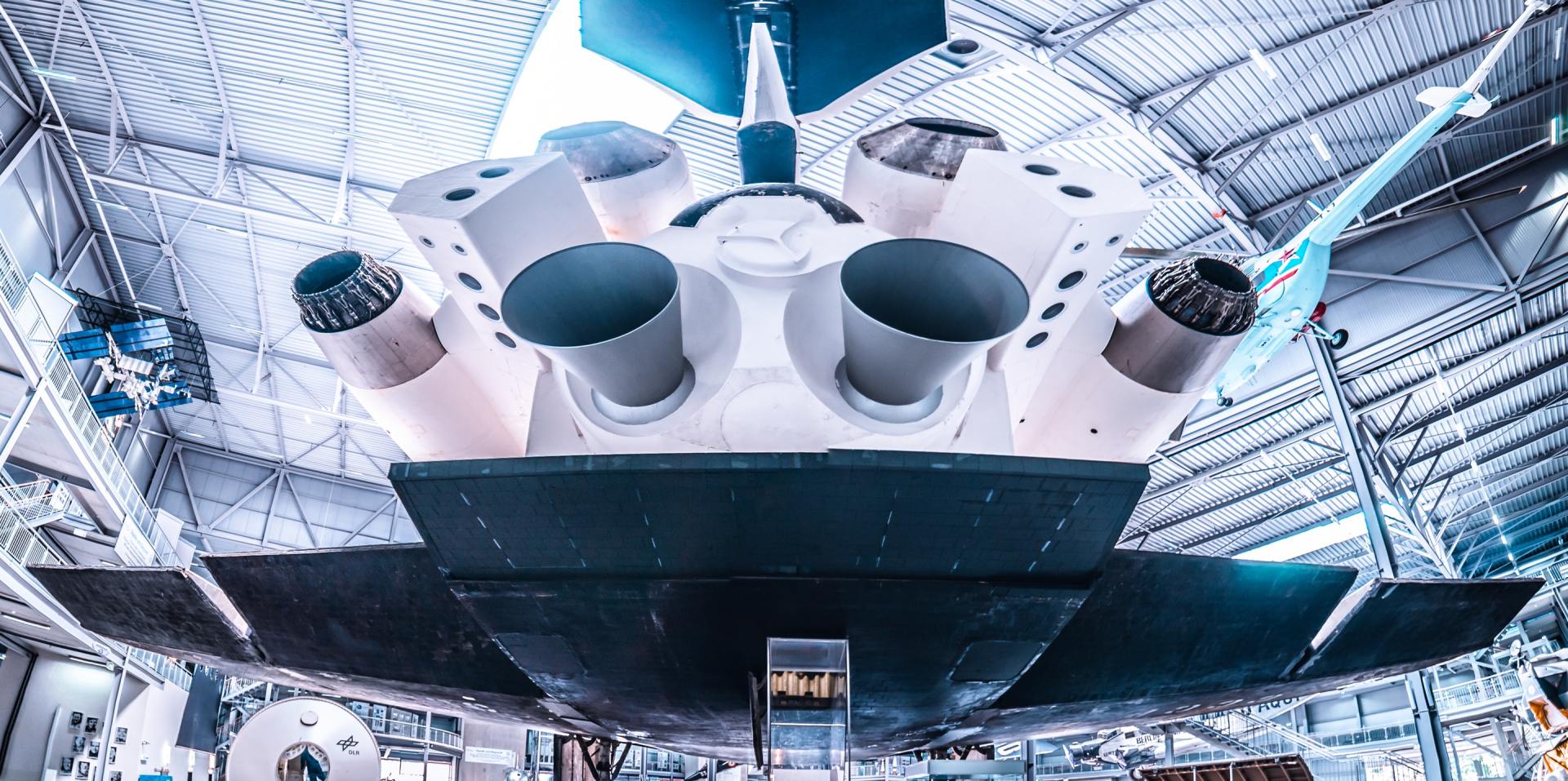 A model of a space shuttle is on display in a museum.