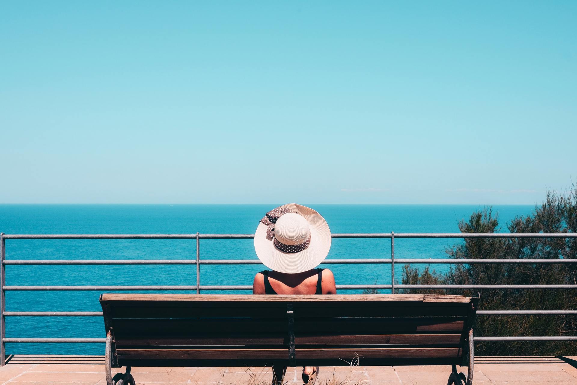woman sitting on bench and link to tenant portal sign in