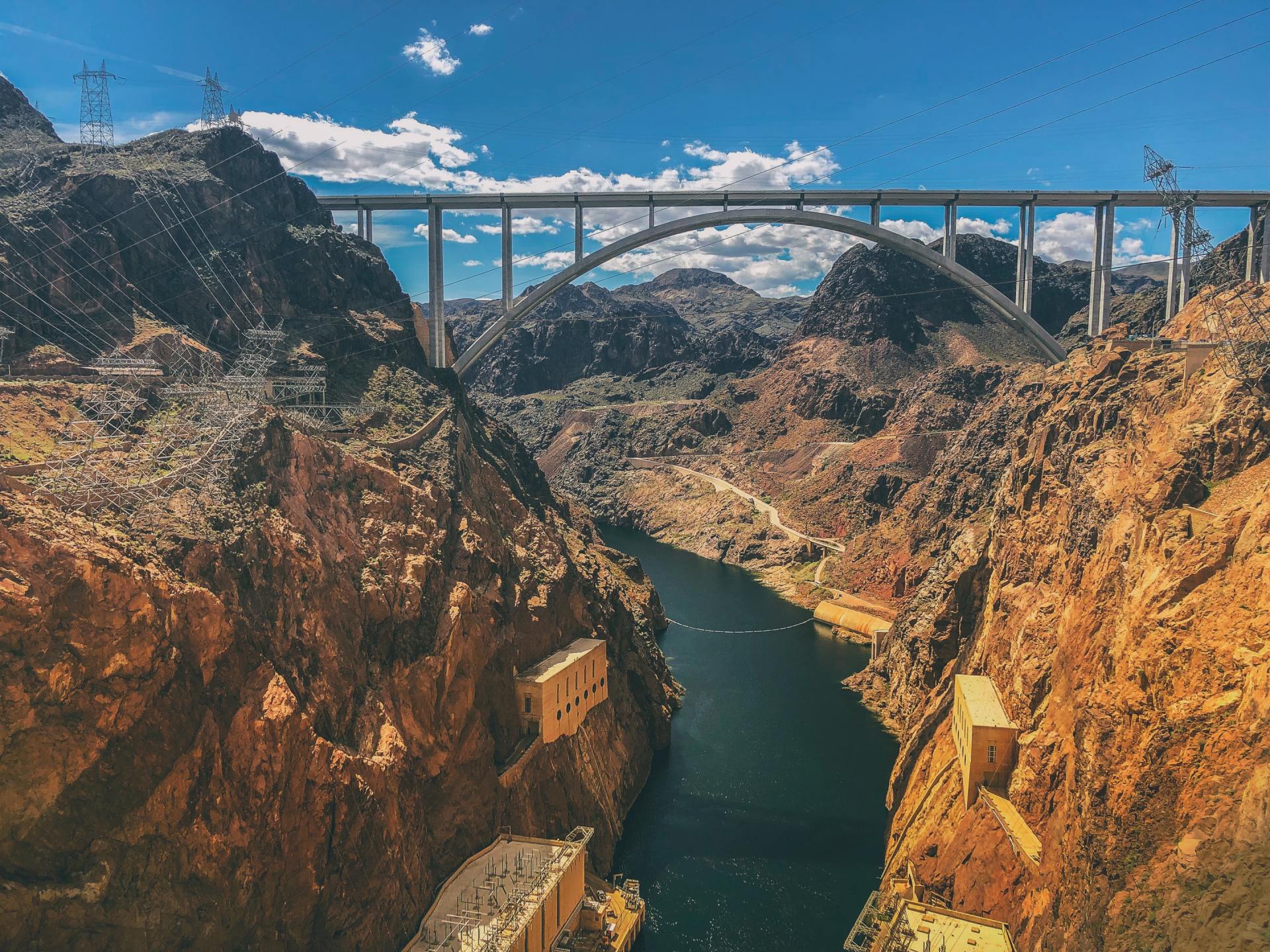 view of Hoover Dam bridge and Colorado river running underneath