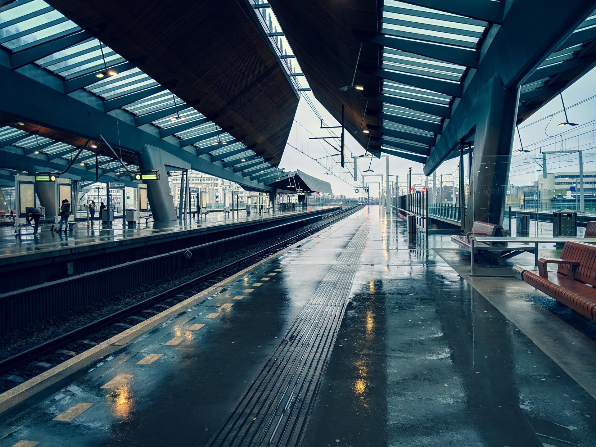 An empty train station on a rainy day
