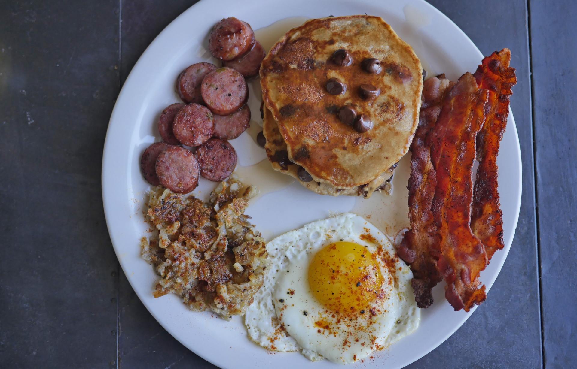 Preparing a cooked breakfast in the kitchen of Fraser's Fryups