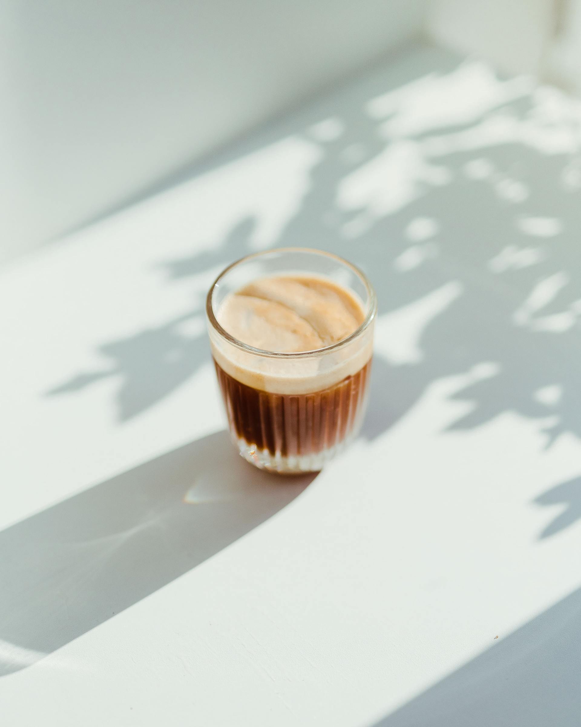 A coffee beverage in a glass