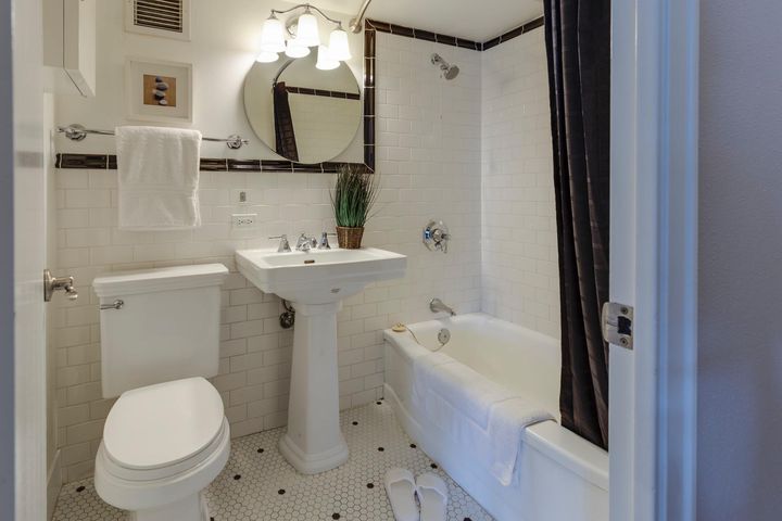 remodeled bathroom with white tile