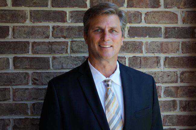 Man in front of a wall