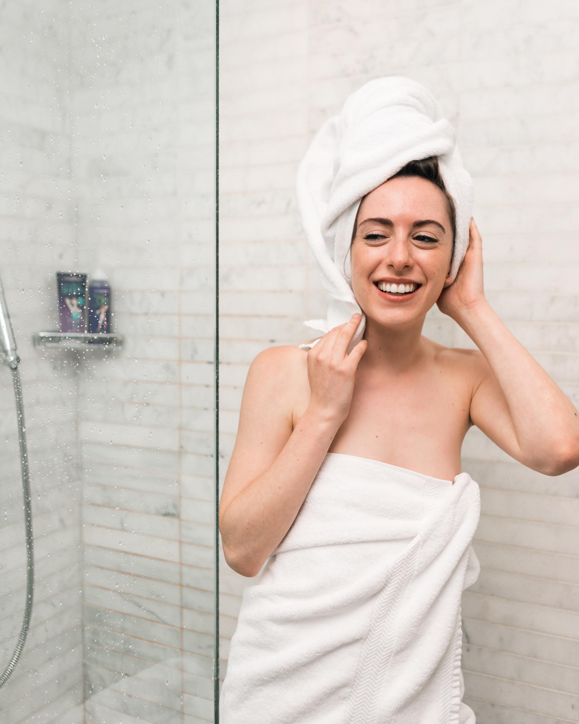 woman wrapped in towels after warm shower